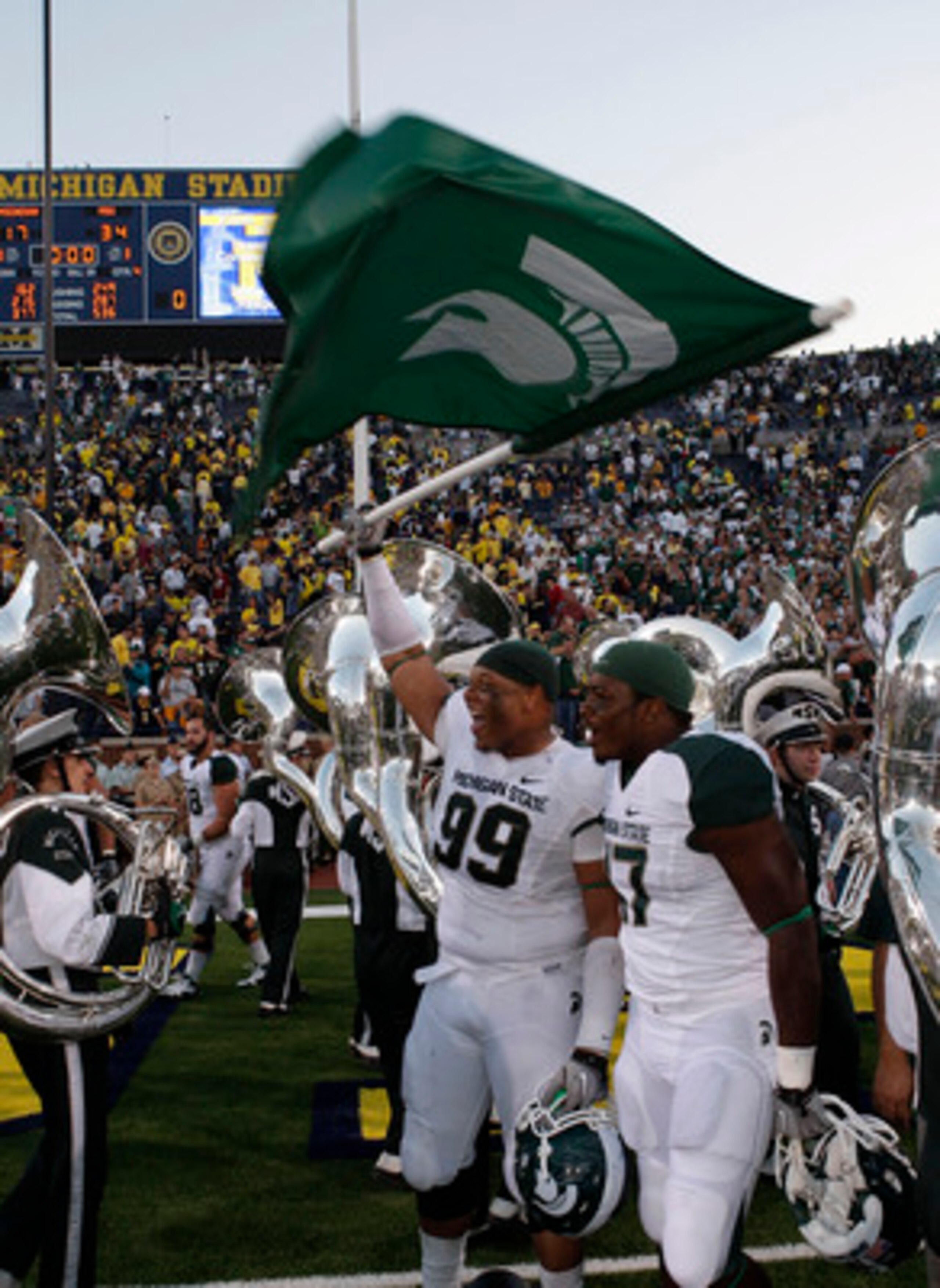 ANN ARBOR, MI - OCTOBER 09: Jerel Worthy #99 of the Michigan State Spartans waves the Spartan Flag after defeating the Michigan Wolverines 34-17 on October 9, 2010 at Michigan Stadium in Ann Arbor, Michigan. (Photo by Leon Halip/Getty Images)