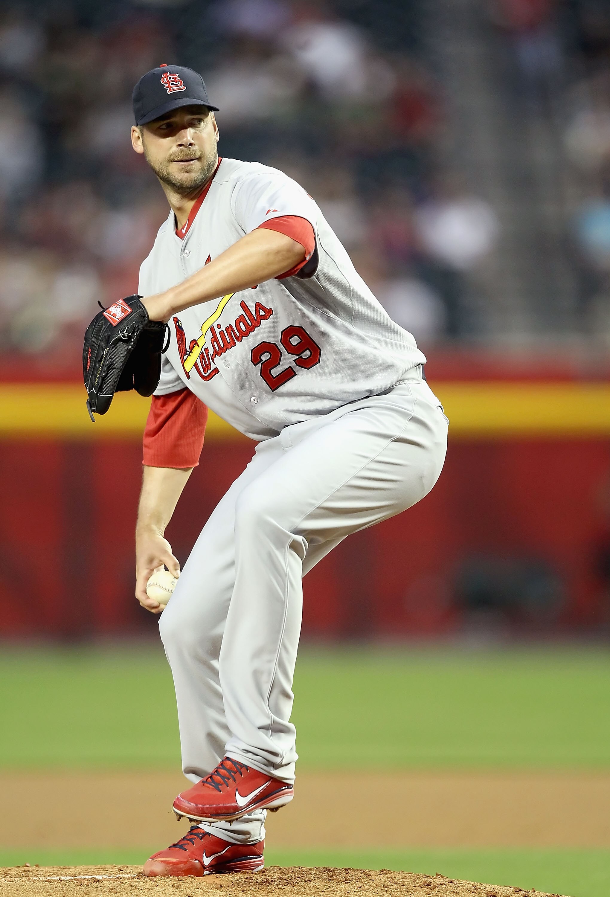 PHOENIX, AZ - APRIL 12:  Starting pitcher Chris Carpenter #29 of the St. Louis Cardinals pitches against the Arizona Diamondbacks during the Major League Baseball game at Chase Field on April 12, 2011 in Phoenix, Arizona. The Diamondbacks defeated the Car