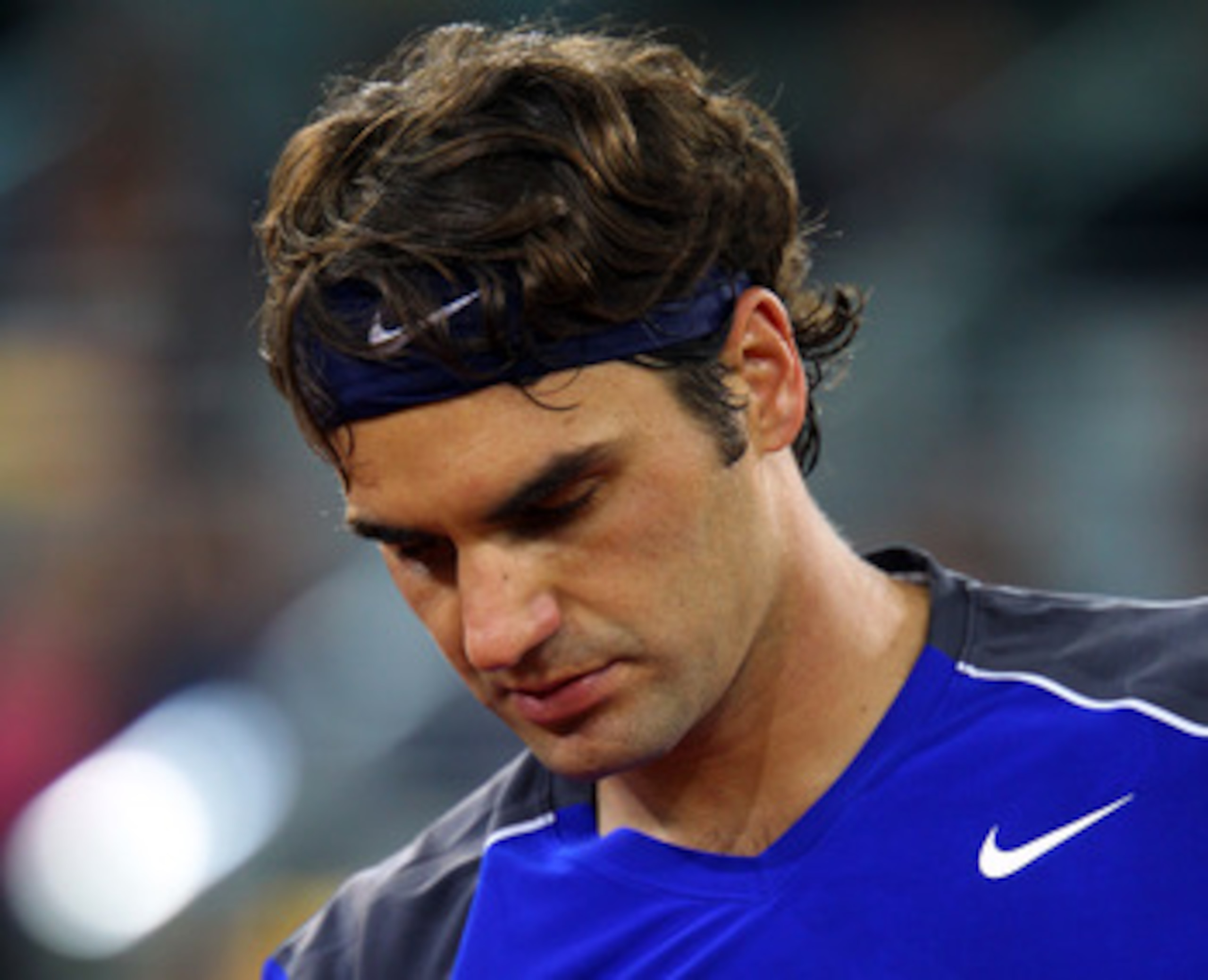 MADRID, SPAIN - MAY 07:  Roger Federer of Switzerland looks down in his match against Rafael Nadal of Spain during day eight of the Mutua Madrilena Madrid Open Tennis on May 7, 2011 in Madrid, Spain.  (Photo by Julian Finney/Getty Images)