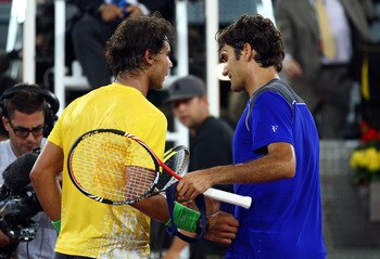 MADRID, SPAIN - MAY 07:  Roger Federer of Switzerland shakes hands with Rafael Nadal of Spain after Nadal won in 3 sets during day eight of the Mutua Madrilena Madrid Open Tennis on May 7, 2011 in Madrid, Spain.  (Photo by Julian Finney/Getty Images)