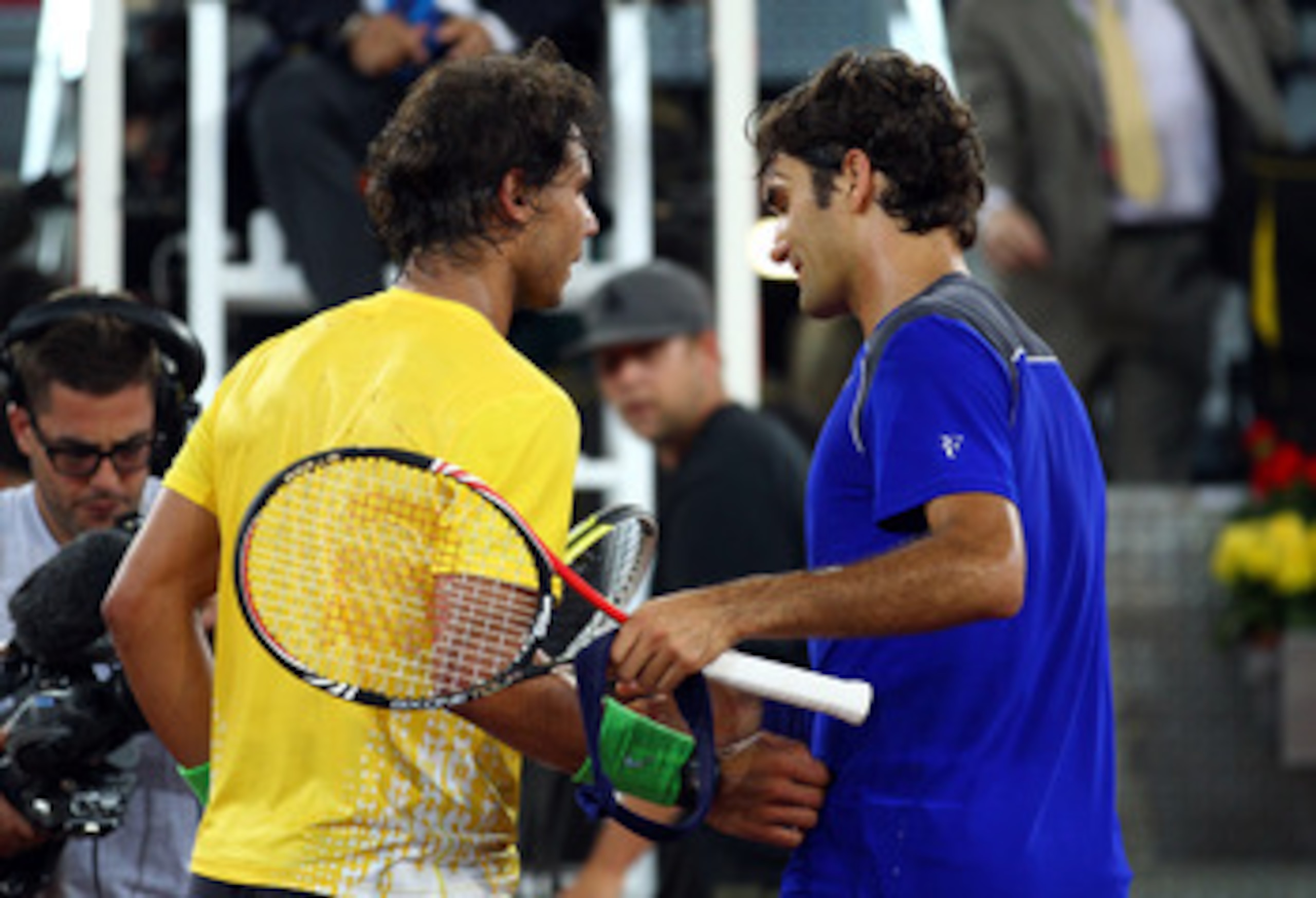 MADRID, SPAIN - MAY 07:  Roger Federer of Switzerland shakes hands with Rafael Nadal of Spain after Nadal won in 3 sets during day eight of the Mutua Madrilena Madrid Open Tennis on May 7, 2011 in Madrid, Spain.  (Photo by Julian Finney/Getty Images)