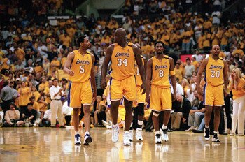 LOS ANGELES - JUNE 4:  Robert Horry #5, Shaquille O'Neal #34, Kobe Bryant #8 and Brian Shaw #20 of the Los Angeles Lakers walk on the court during Game 7 of the Western Conference Finals against the Portland Trail Blazers at Staples Center on June 4, 2000