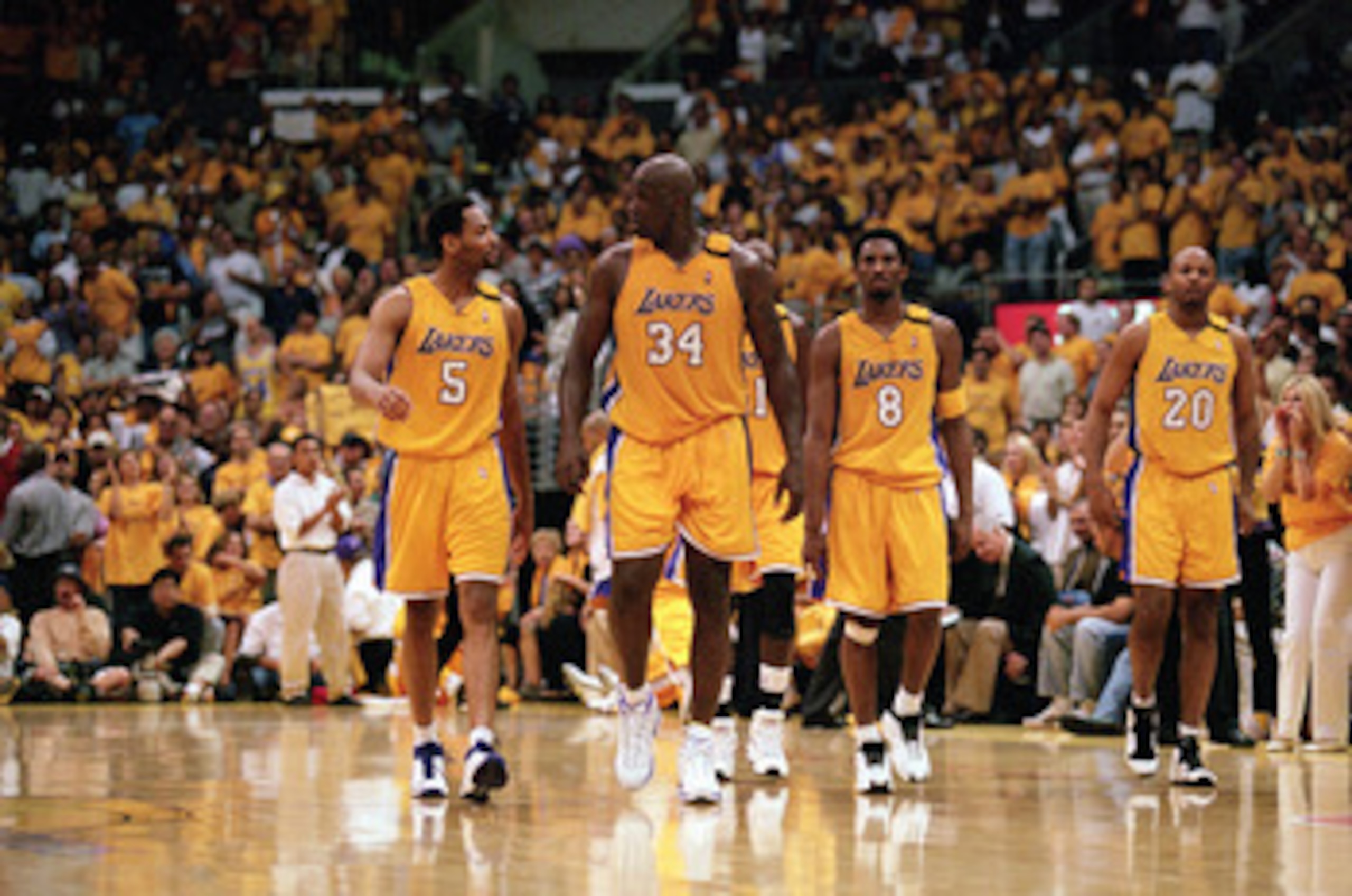 LOS ANGELES - JUNE 4:  Robert Horry #5, Shaquille O'Neal #34, Kobe Bryant #8 and Brian Shaw #20 of the Los Angeles Lakers walk on the court during Game 7 of the Western Conference Finals against the Portland Trail Blazers at Staples Center on June 4, 2000
