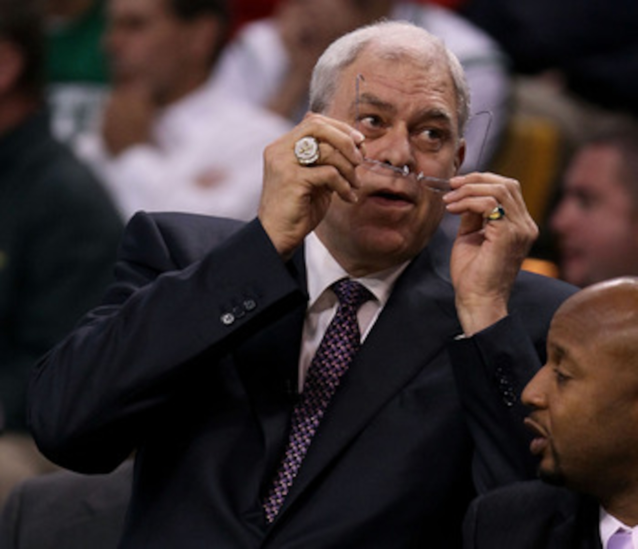 BOSTON - JUNE 10:  Head coach Phil Jackson of the Los Angeles Lakers adjusts his glasses in the first half against the Boston Celltics during Game Four of the 2010 NBA Finals on June 10, 2010 at TD Garden in Boston, Massachusetts. NOTE TO USER: User expre