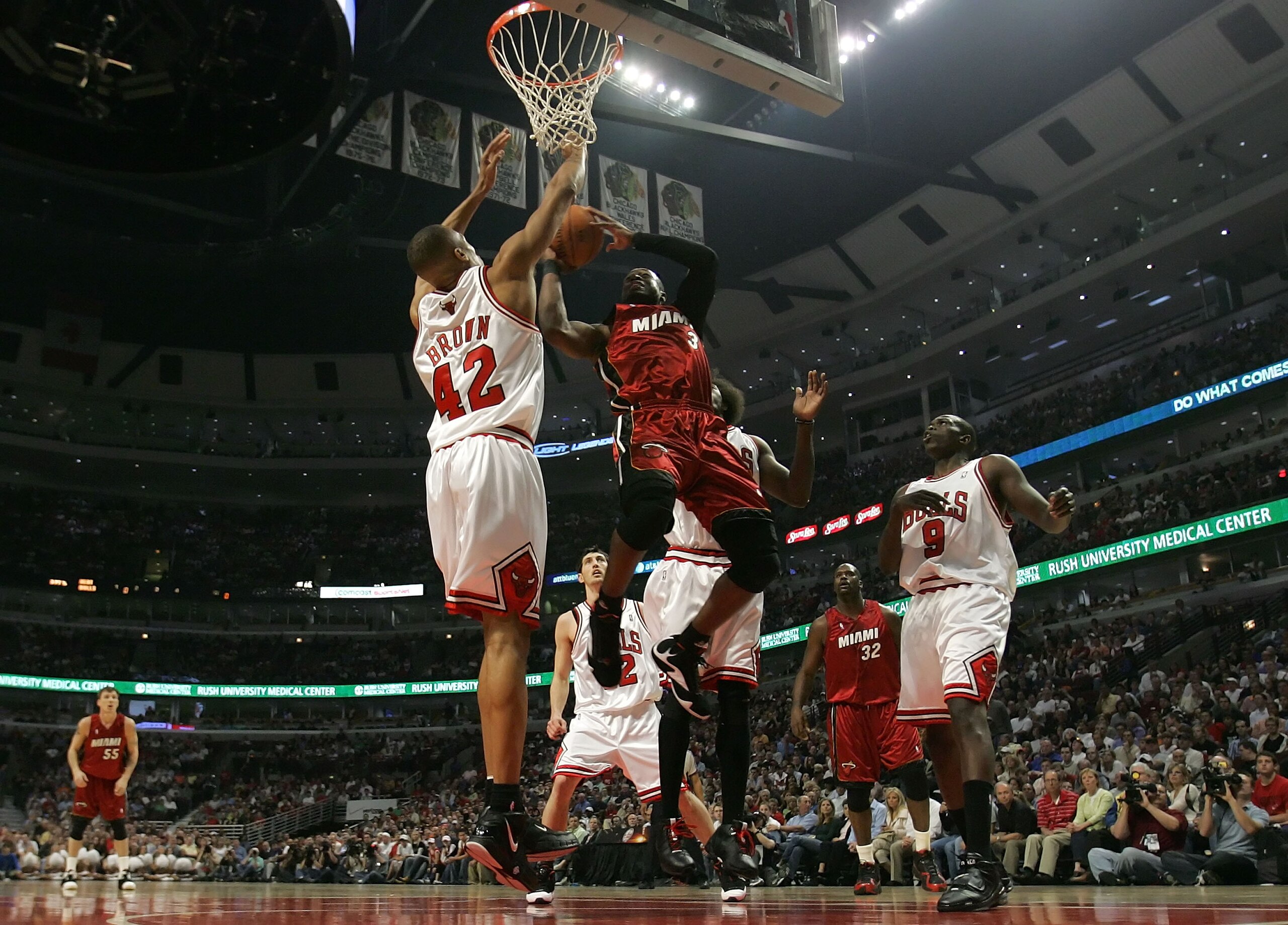 CHICAGO - APRIL 21:  Dwyane Wade #3 of the Miami Heat drives for a shot attempt against P.J. Brown #42 and Luol Deng #9 of the Chicago Bulls in Game One of the Eastern Conference Quarterfinals during the 2007 NBA Playoffs at the United Center Center on Ap