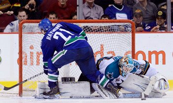 VANCOUVER, CANADA - JANUARY 20: Mason Raymond #21 of the Vancouver Canucks is stopped by goalie Antti Niemi #31 of the San Jose Sharks during the shootout in NHL action on January 20, 2011 at Rogers Arena in Vancouver, BC, Canada.  (Photo by Rich Lam/Gett
