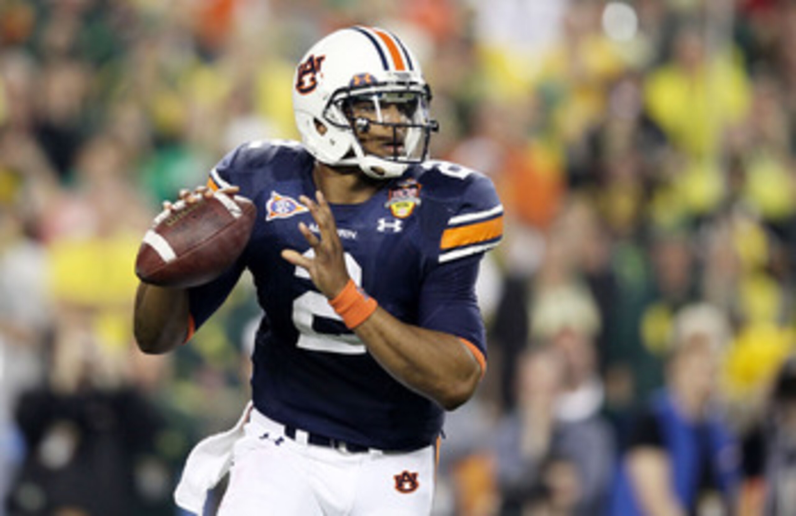 GLENDALE, AZ - JANUARY 10:  Cameron Newton #2 of the Auburn Tigers scrambles against the Oregon Ducks during the Tostitos BCS National Championship Game at University of Phoenix Stadium on January 10, 2011 in Glendale, Arizona.  (Photo by Christian Peters