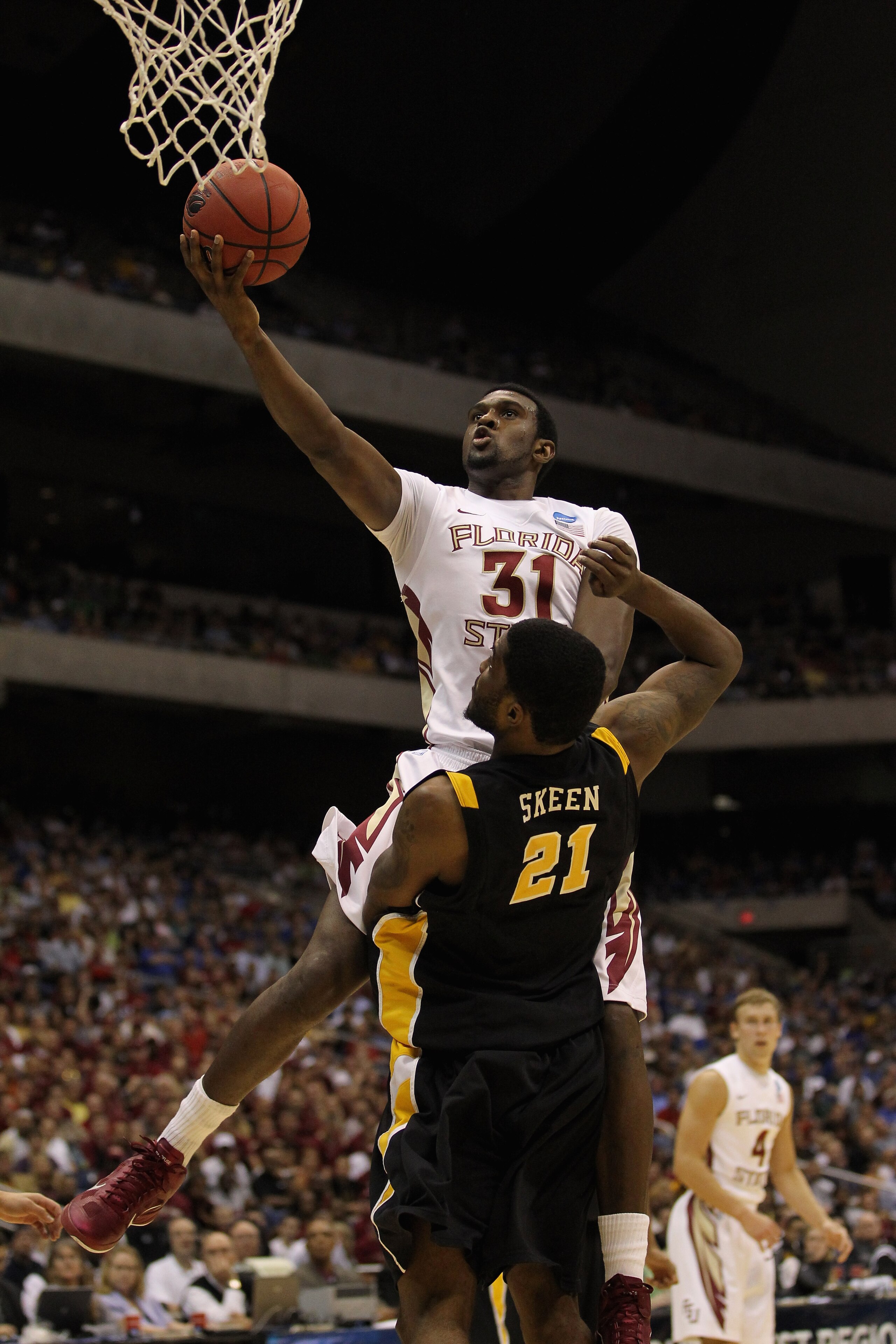 SAN ANTONIO, TX - MARCH 25:  Chris Singleton #31 of the Florida State Seminoles goes to the basket against Jamie Skeen #21 of the Virginia Commonwealth Rams during the southwest regional of the 2011 NCAA men's basketball tournament at the Alamodome on Mar