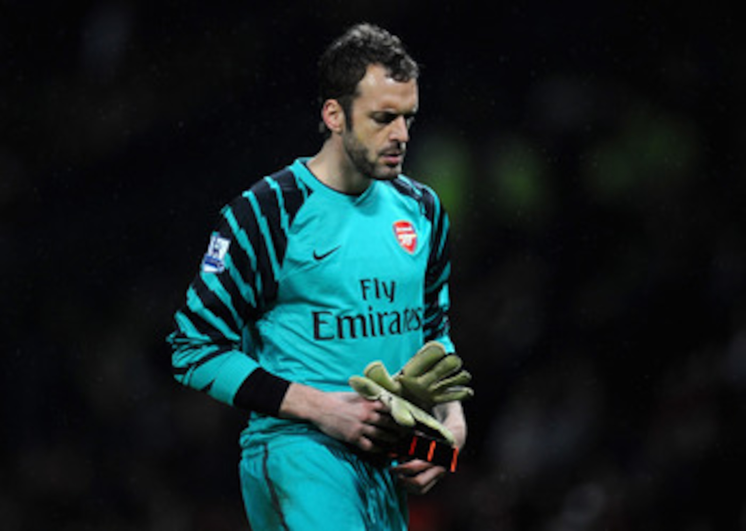 MANCHESTER, ENGLAND - MARCH 12:  Manuel Almunia of Arsenal looks dejected after defeat in the FA Cup sponsored by E.On Sixth Round match between Manchester United and Arsenal at Old Trafford on March 12, 2011 in Manchester, England.  (Photo by Clive Mason