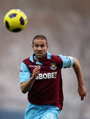 BLACKBURN, ENGLAND - DECEMBER 18:  Matthew Upson of West Ham chases the lose ball during the Barclays Premier League match between Blackburn Rovers and West Ham United at Ewood park on December 18, 2010 in Blackburn, England.  (Photo by Dean Mouhtaropoulo