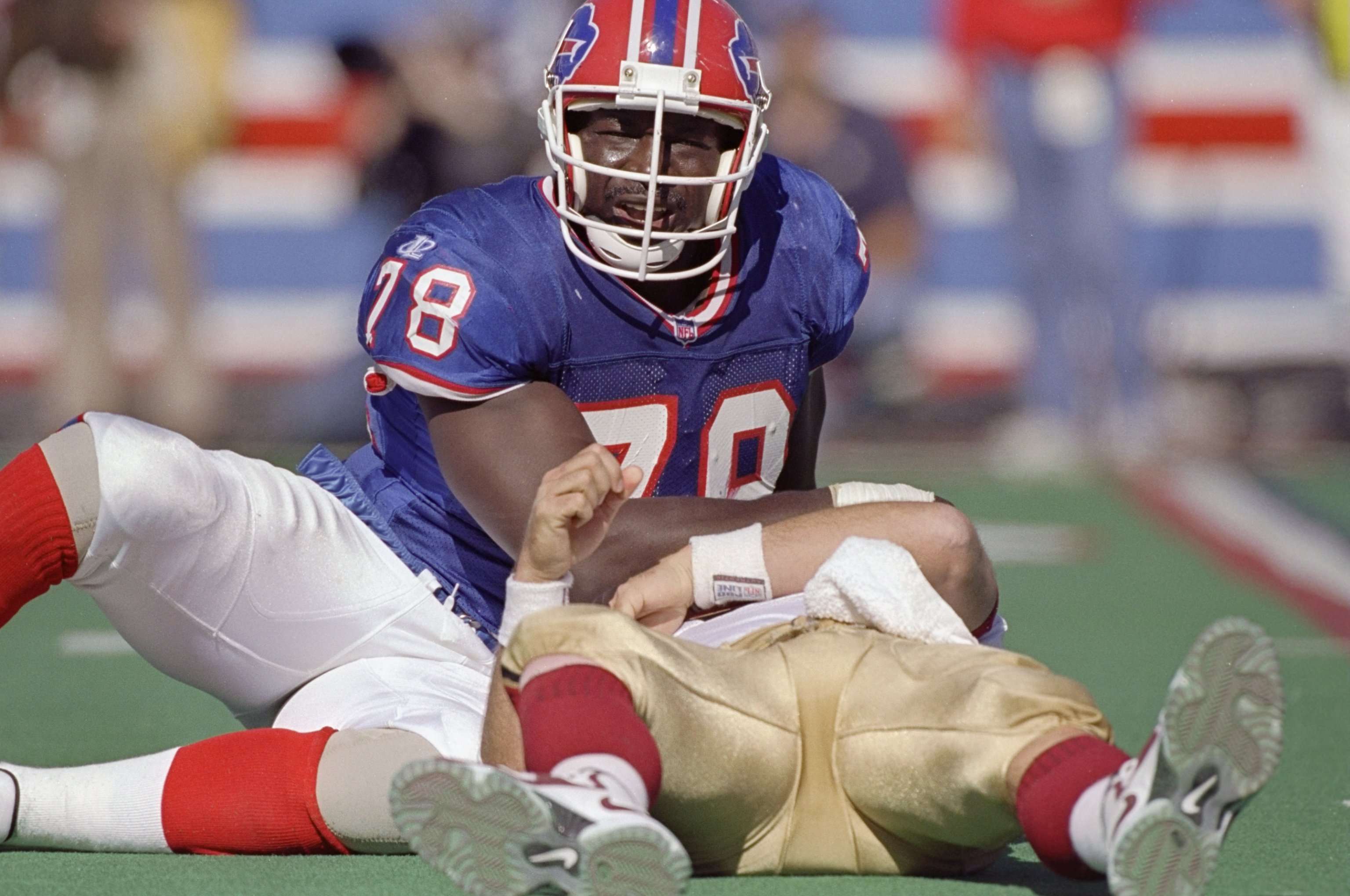 4 Oct 1998:  Defensive end Bruce Smith #78 of the Buffalo Bills sacks quarterback Steve Young #8 of the San Francisco 49ers during a game at the Bills Stadium in Orchard Park, New York. The Bills defeated the 49ers 26-21. Mandatory Credit: Rick Stewart  /
