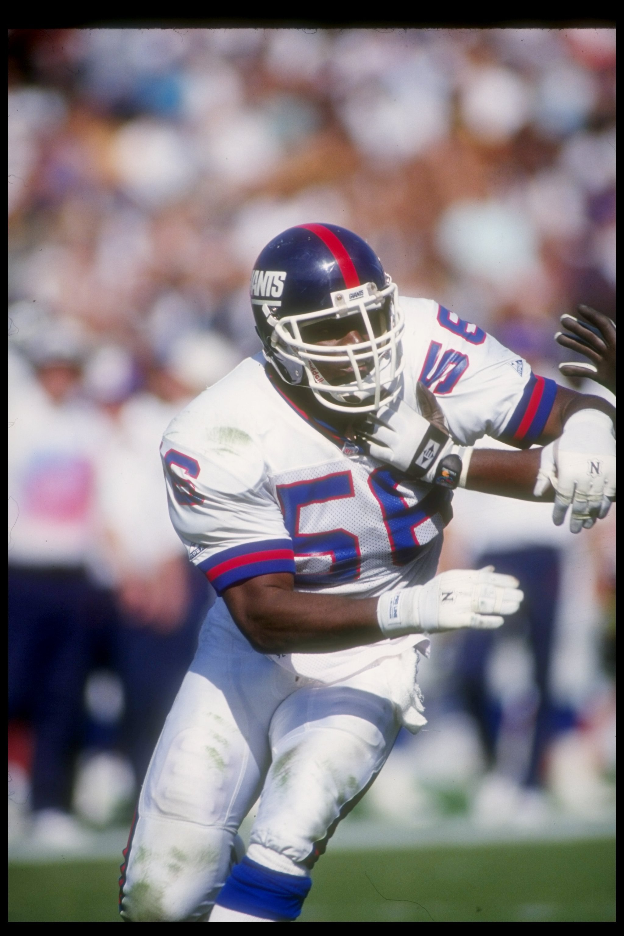 4 Oct 1992:  Linebacker Lawrence Taylor of the New York Giants works against the Los Angeles Raiders during a game at the Los Angeles Memorial Coliseum in Los Angeles, California.  The Raiders won the game, 13-10. Mandatory Credit: Ken Levine  /Allsport