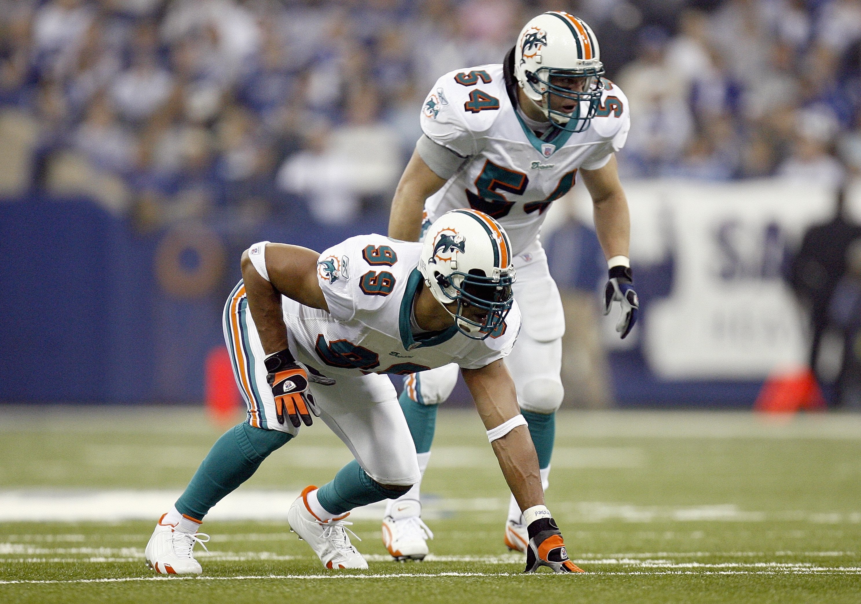 INDIANAPOLIS - DECEMBER 31: Jason Taylor #99 and Zach Thomas #54 of the Miami Dolphins get ready to move at the snap during the game against the Indianapolis Colts at the RCA Dome on December 31, 2006 in Indianapolis, Indiana. Indianapolis won the game 27