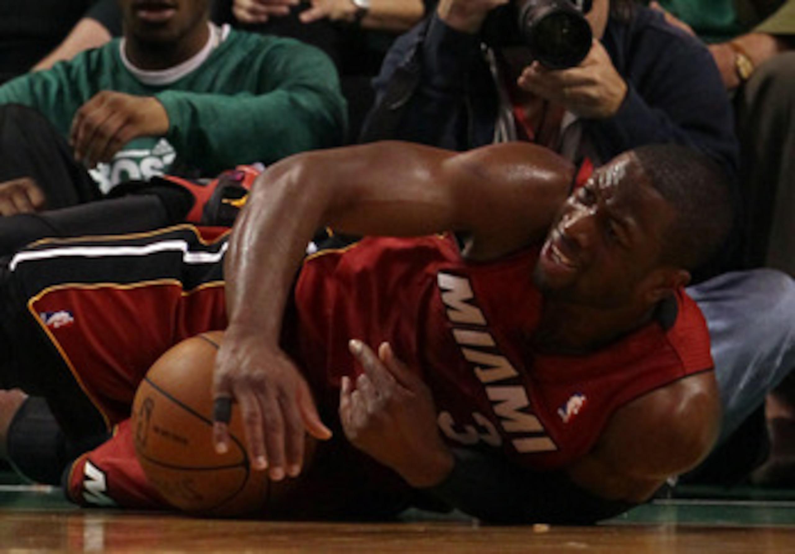 BOSTON, MA - MAY 07:  Dwyane Wade #3 of the Miami Heat scrambles to keep the ball but is called for traveling in the first quarter against the Boston Celtics in Game Three of the Eastern Conference Semifinals in the 2011 NBA Playoffs on May 7, 2011 at the