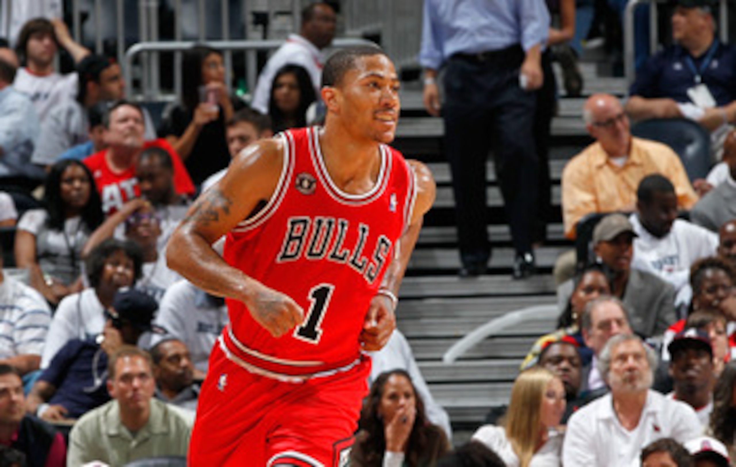 ATLANTA, GA - MAY 12:  Derrick Rose #1 of the Chicago Bulls reacts after scoring a basket against the Atlanta Hawks in Game Six of the Eastern Conference Semifinals in the 2011 NBA Playoffs at Phillips Arena on May 12, 2011 in Atlanta, Georgia.  NOTE TO U