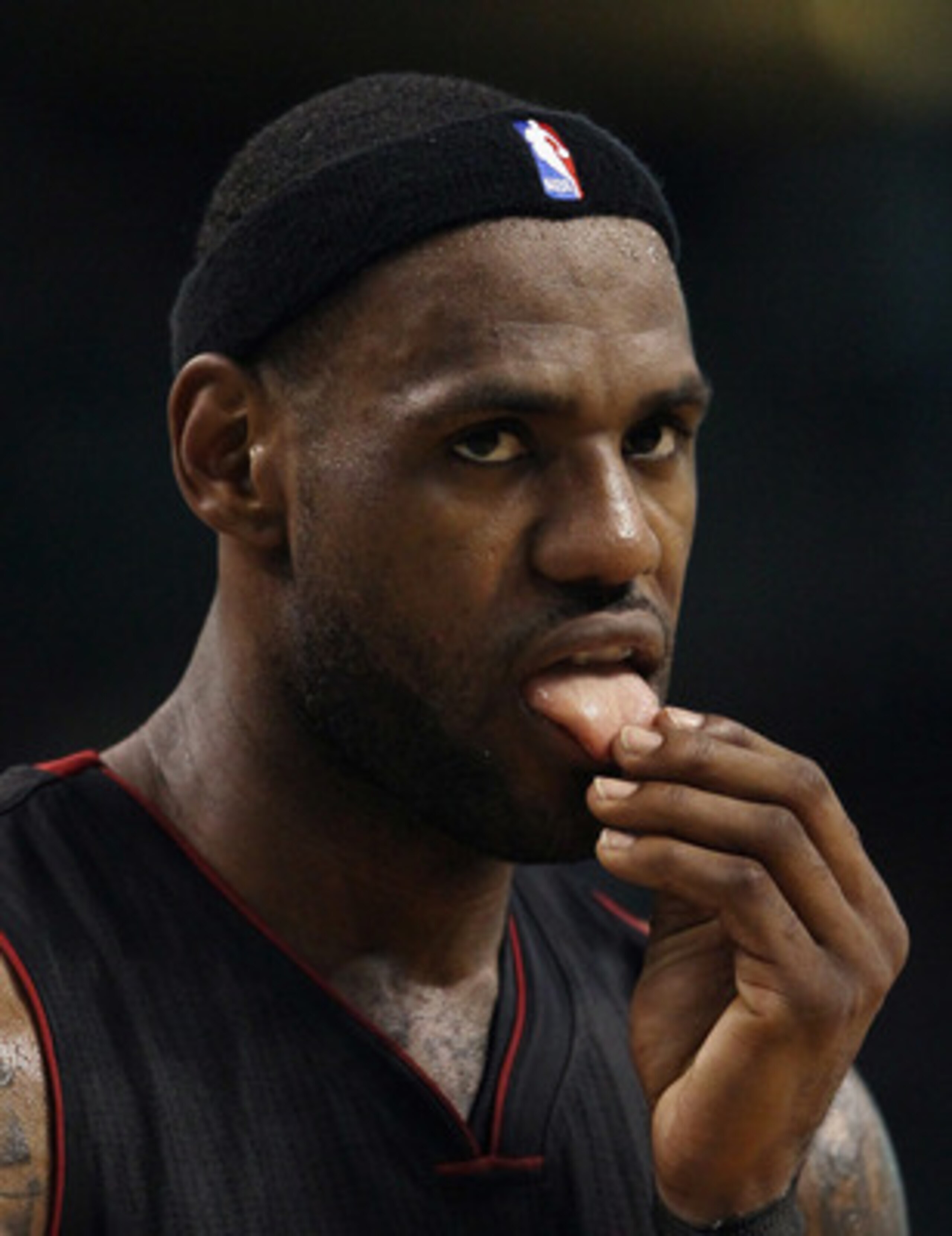 BOSTON, MA - MAY 09:  LeBron James #6 of the Miami Heat licks his fingers against the Boston Celtics in Game Four of the Eastern Conference Semifinals in the 2011 NBA Playoffs on May 9, 2011 at the TD Garden in Boston, Massachusetts.  The Miami Heat defea