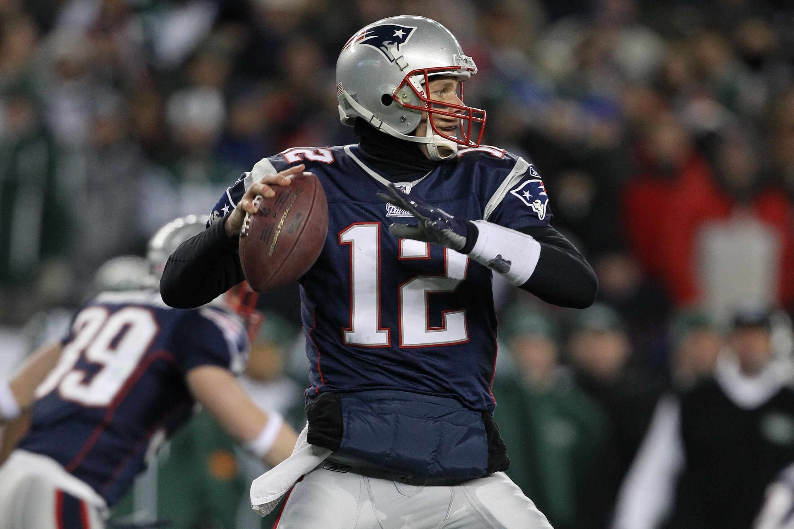 FOXBORO, MA - JANUARY 16:  Quarterback Tom Brady #12 of the New England Patriots looks to pass during their 2011 AFC divisional playoff game against the New York Jets at Gillette Stadium on January 16, 2011 in Foxboro, Massachusetts.  (Photo by Al Bello/G