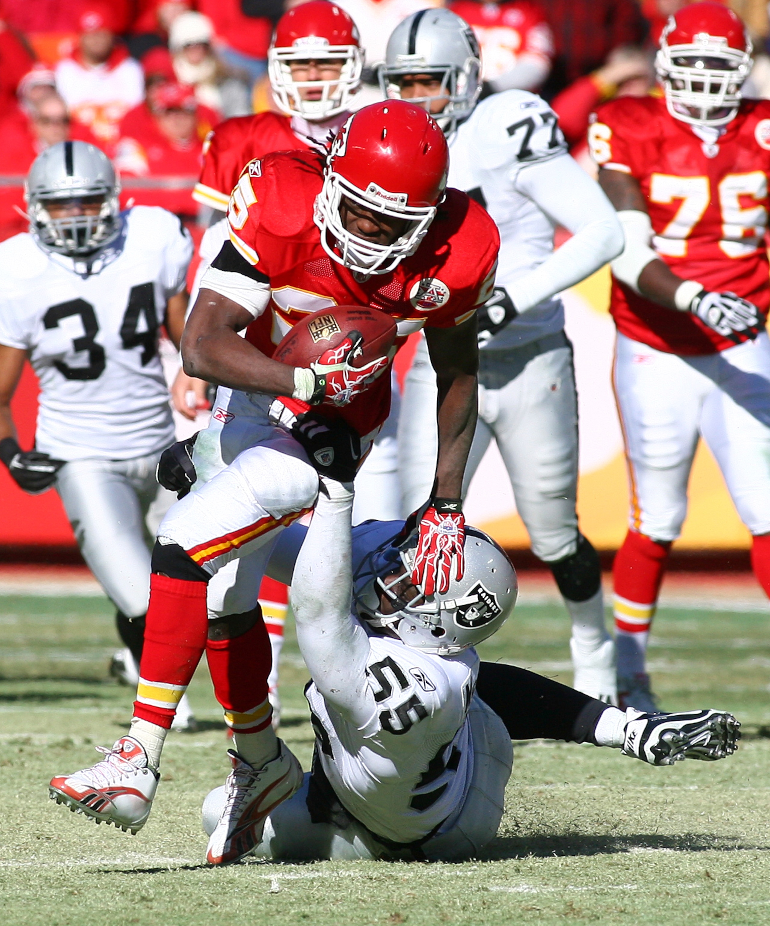 KANSAS CITY, MO - JANUARY 02: Running back Jamaal Charles #25 of the Kansas City Chiefs is tackled by linebacker Rolando McClain #55 of the Oakland Raiders in a game at Arrowhead Stadium on January 2, 2011 in Kansas City, Missouri. (Photo by Tim Umphrey KANSAS CITY, MO - JANUARY 02: Running back Jamaal Charles #25 of the Kansas City Chiefs is tackled by linebacker Rolando McClain #55 of the Oakland Raiders in a game at Arrowhead Stadium on January 2, 2011 in Kansas City, Missouri. (Photo by Tim Umphrey