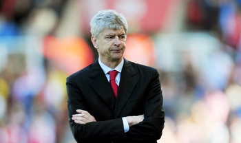 STOKE ON TRENT, ENGLAND - MAY 08:  A dejected Arsene Wenger the Arsenal manager looks on as his team head towards a 3-1 defeat during the Barclays Premier League match between Stoke City and Arsenal at the Britannia Stadium on May 8, 2011 in Stoke on Tren