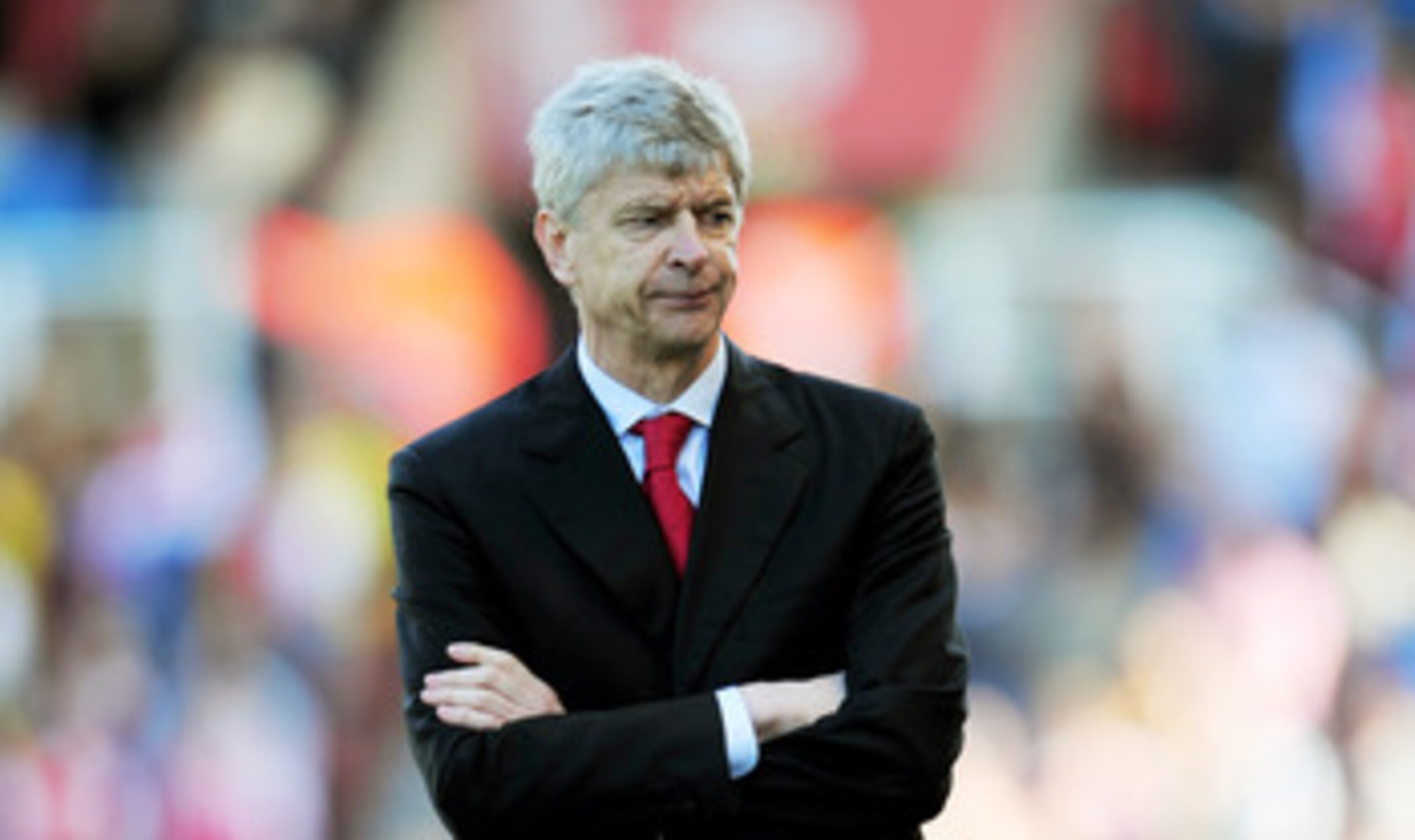 STOKE ON TRENT, ENGLAND - MAY 08:  A dejected Arsene Wenger the Arsenal manager looks on as his team head towards a 3-1 defeat during the Barclays Premier League match between Stoke City and Arsenal at the Britannia Stadium on May 8, 2011 in Stoke on Tren