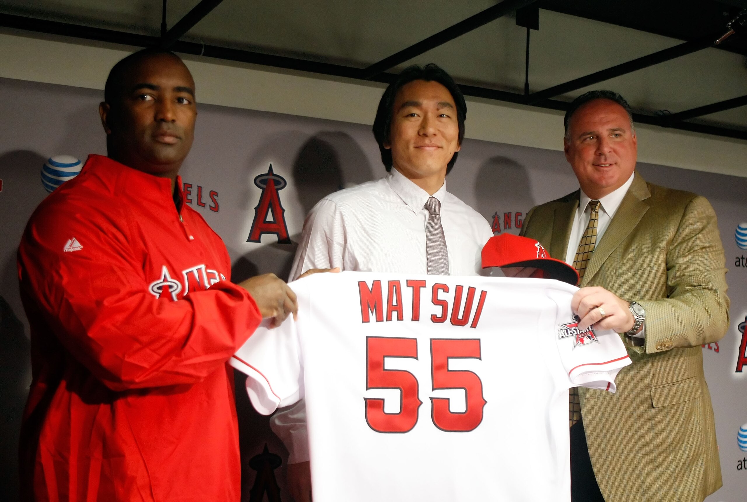 ANAHEIM, CA - DECEMBER 16:  (L-R) General manager Tony Reagins, Hideki Matsui and manager Mike Scioscia of the Los Angeles Angels of Anaheim pose for a portrait during a press conference at Angel Stadium of Anaheim on December 16, 2009 in Anaheim, Califor
