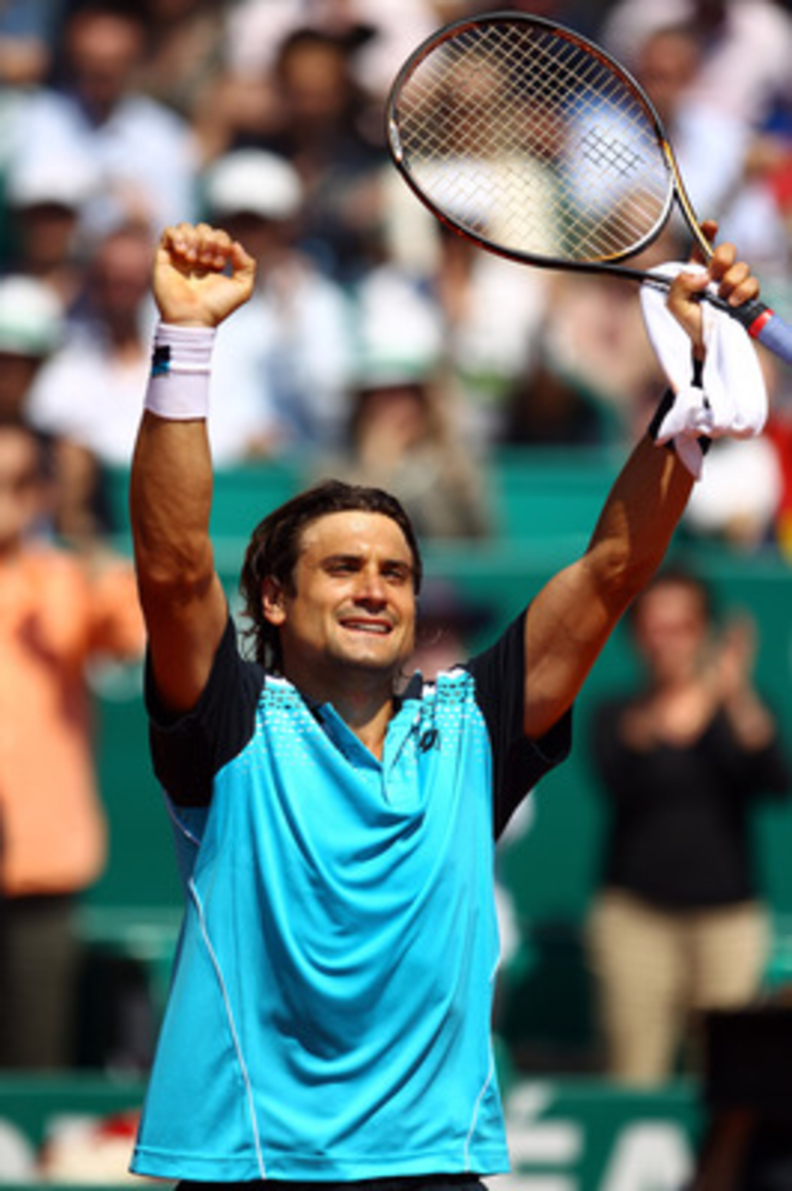MONACO - APRIL 16:  David Ferrer of Spain celebrates defeating Jurgen Melzer of Austria during Day Seven of the ATP Masters Series Tennis at the Monte Carlo Country Club on April 16, 2011 in Monte Carlo, Monaco.  (Photo by Julian Finney/Getty Images)