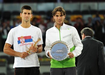 MADRID, SPAIN - MAY 08: Novak Djokovic (L) of Serbia holds the Ion Tiriac's trophy besides runner up Rafael Nadal of Spain during the price giving ceremony on day eight of the Mutua Madrilena Madrid Open Tennis on May 8, 2011 in Madrid, Spain. (Photo by MADRID, SPAIN - MAY 08: Novak Djokovic (L) of Serbia holds the Ion Tiriac's trophy besides runner up Rafael Nadal of Spain during the price giving ceremony on day eight of the Mutua Madrilena Madrid Open Tennis on May 8, 2011 in Madrid, Spain. (Photo by