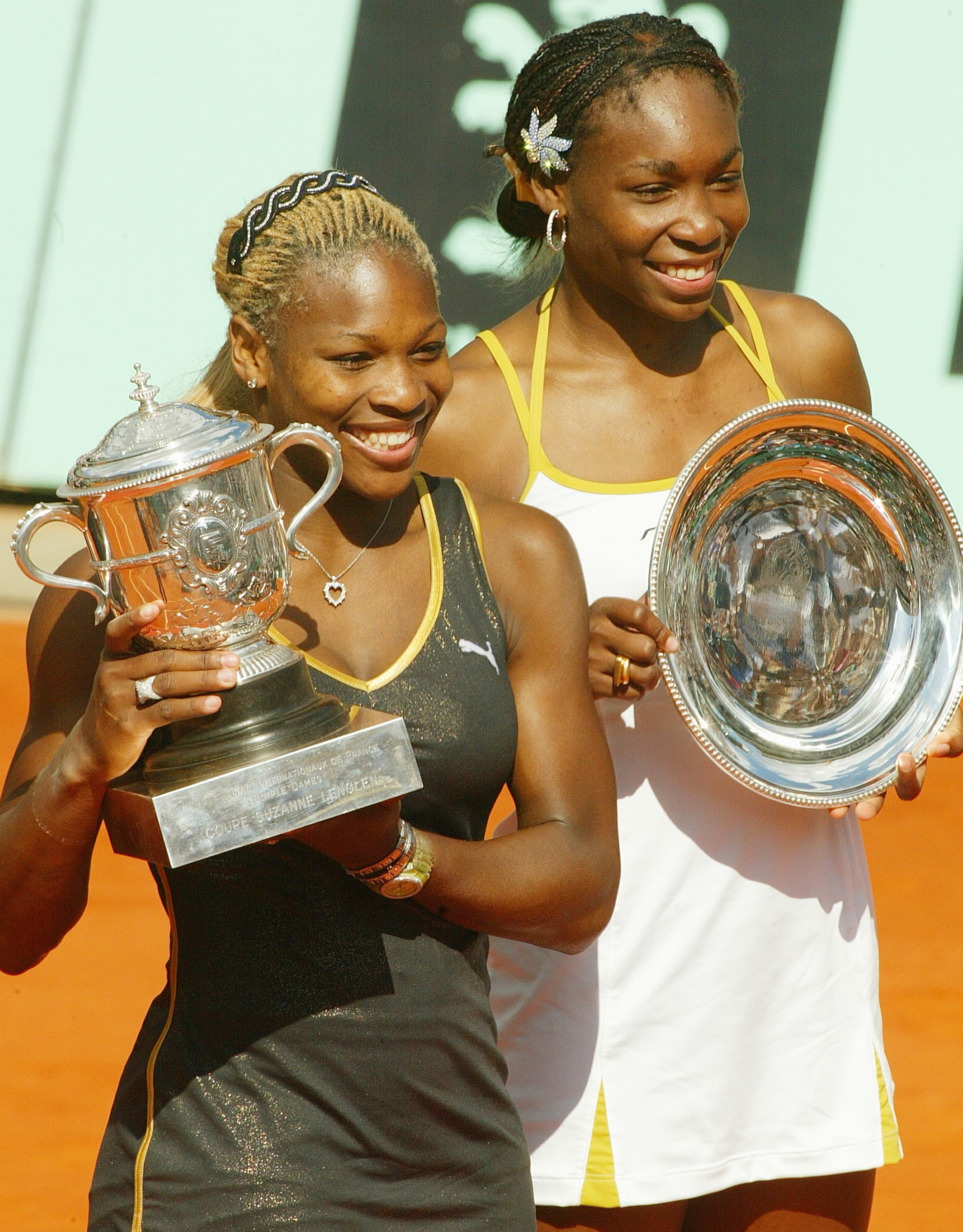 PARIS - JUNE 8: Serena Williams (left) and sister Venus of the USA pose with thire trophies after the French Open final on June 8, 2002 at the Roland Garros stadium in Paris, France. Serena deated Venus 7-5 6-3. (Photo by Pascal Le Segretain/Getty Images)