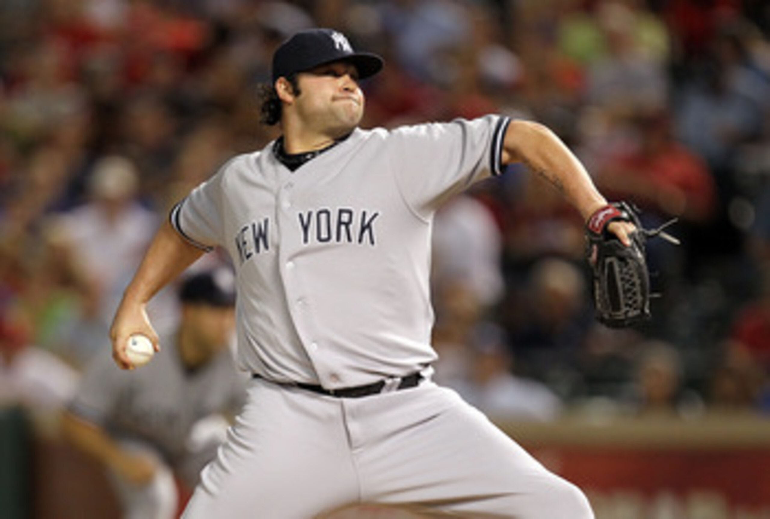 ARLINGTON, TX - MAY 07:  Pitcher Joba Chamberlain #62 of the New York Yankees throws against the Texas Rangers at Rangers Ballpark in Arlington on May 7, 2011 in Arlington, Texas.  (Photo by Ronald Martinez/Getty Images)