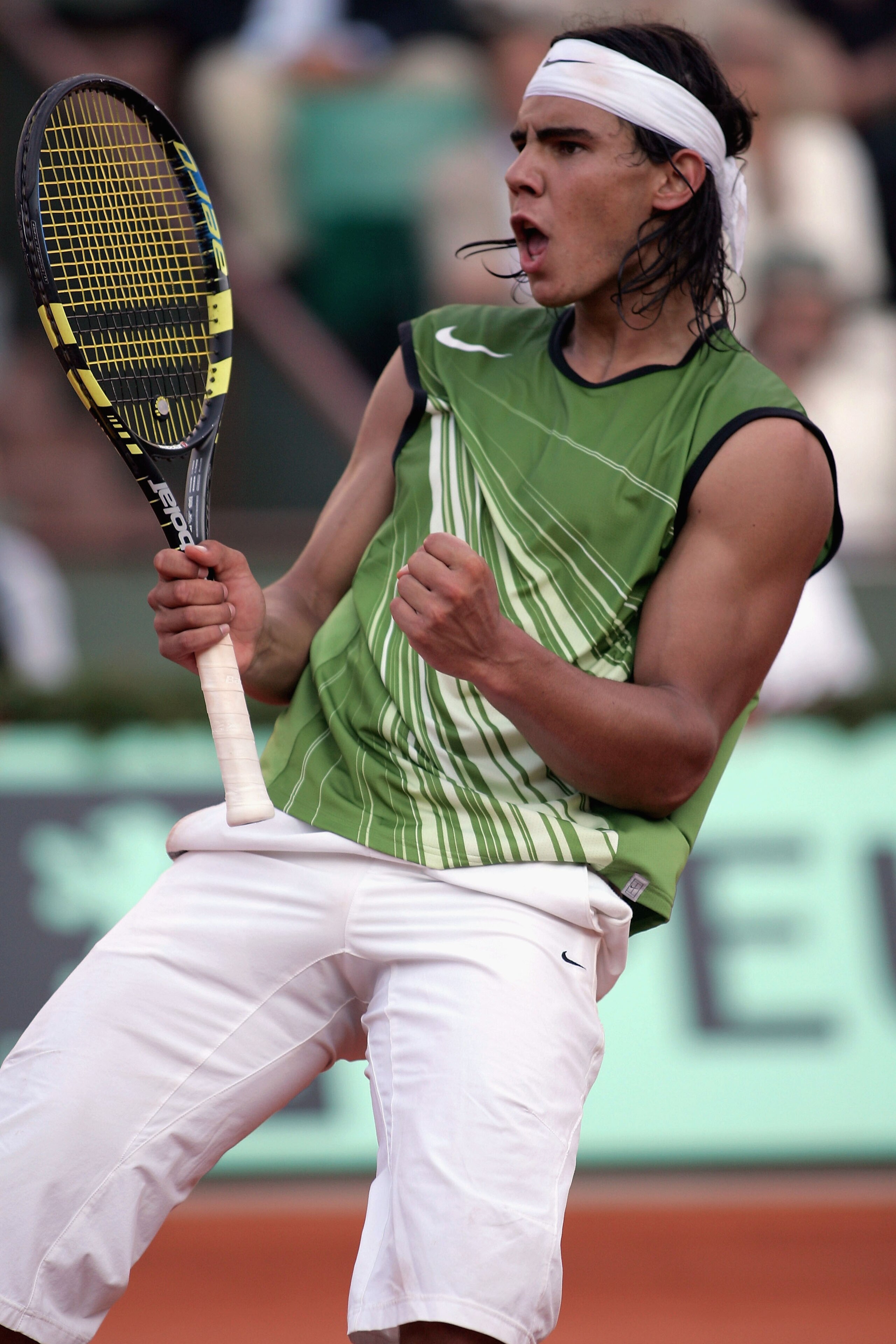 PARIS - JUNE 3:  Rafael Nadal of Spain celebrates match point as he defeats Roger Federer of Switzerland in four sets during his semi-final match on the twelfth day of the French Open at Roland Garros on June 3, 2005 in Paris, France.  (Photo by Michael S