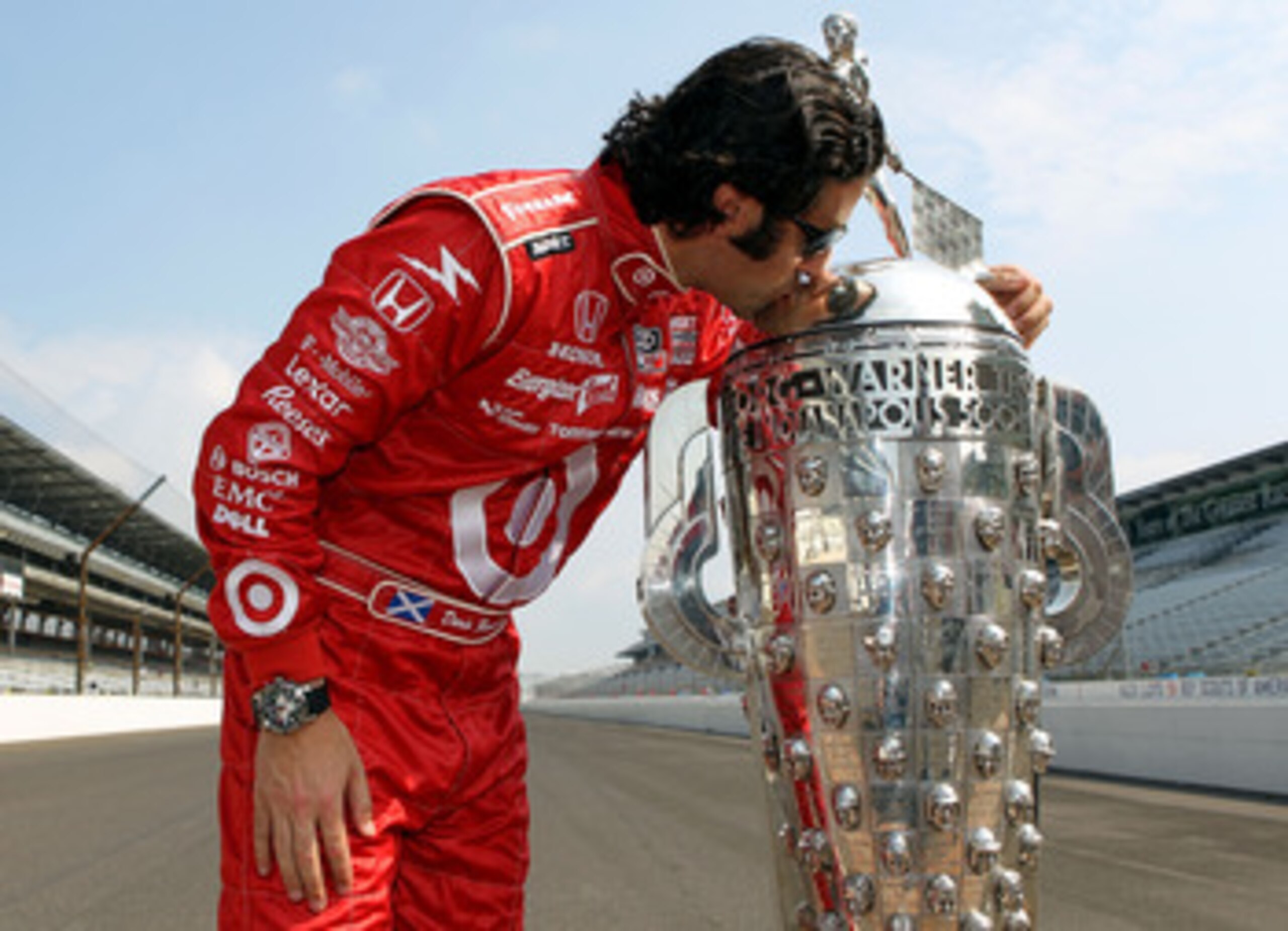 INDIANAPOLIS - MAY 31:  Dario Franchitti of Scotland, driver of the #10 Target Chip Ganassi Racing Dallara Honda, kisses the Borg Warner trophy on the yard of brick during the 94th Indianapolis 500 Trohpy Presentation on May 31, 2010 in Indianapolis, Indi