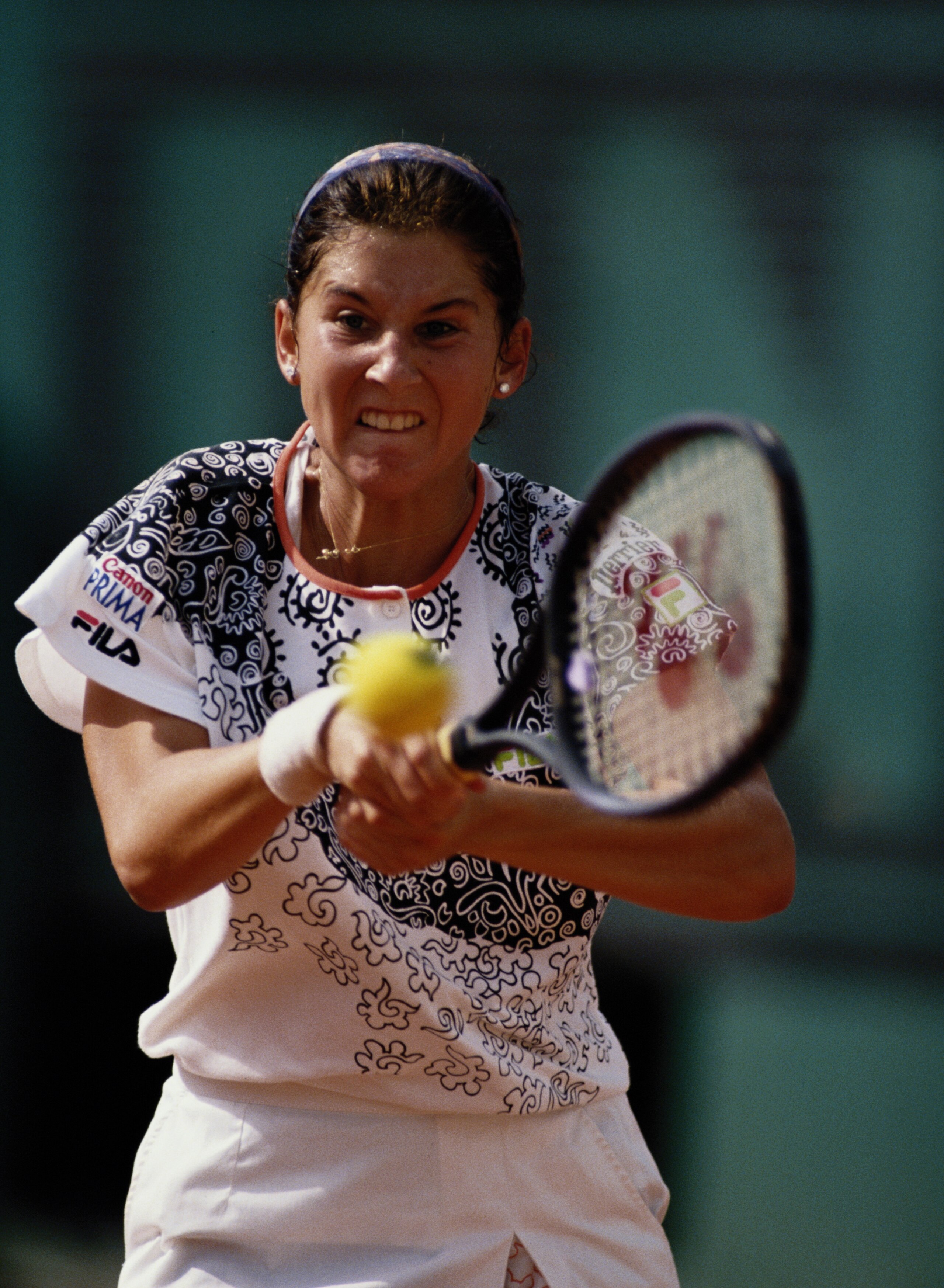 Monica Seles makes a double hand return against Steffi Graf during the Women's Singles final match during the French Open Tennis Championship on 6th June 1992 at the Stade Roland Garros Stadium in Paris, France. ( Photo by Chris Cole/Getty Images)