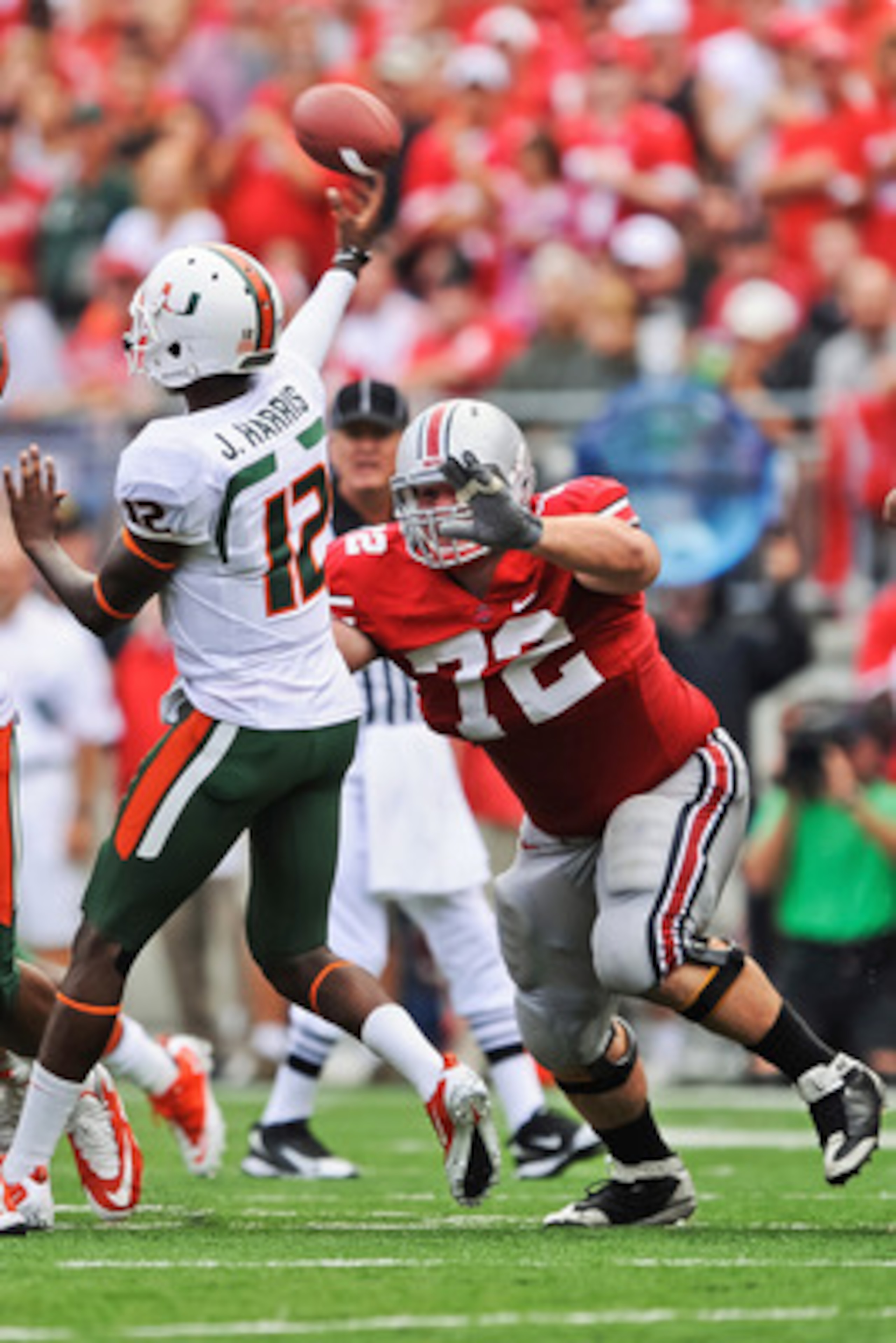 COLUMBUS, OH - SEPTEMBER 11: Dexter Larimore #72 of the Ohio State Buckeyes applies pressure to quarterback Jacory Harris #12 of the Miami Hurricanes at Ohio Stadium on September 11, 2010 in Columbus, Ohio. (Photo by Jamie Sabau/Getty Images) COLUMBUS, OH - SEPTEMBER 11: Dexter Larimore #72 of the Ohio State Buckeyes applies pressure to quarterback Jacory Harris #12 of the Miami Hurricanes at Ohio Stadium on September 11, 2010 in Columbus, Ohio. (Photo by Jamie Sabau/Getty Images)