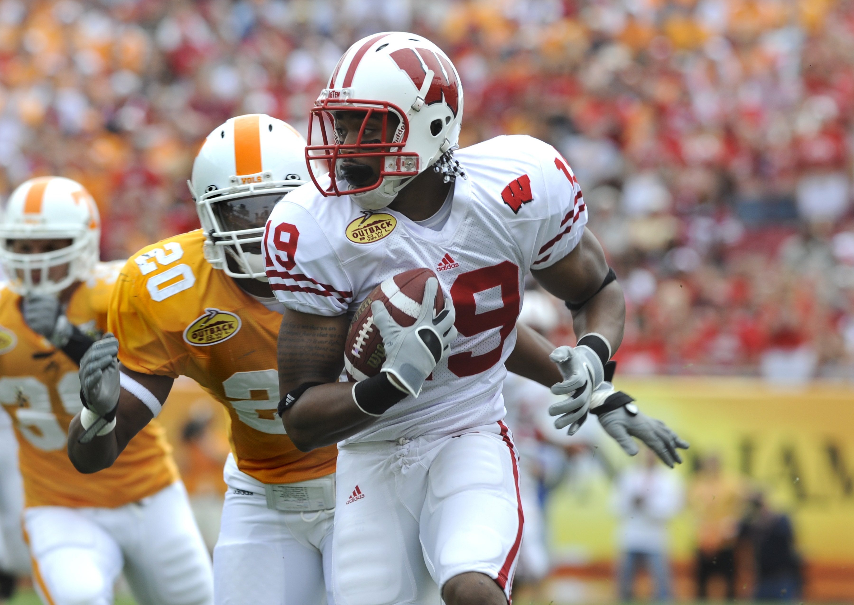 TAMPA, FL -  JANUARY 1: Wide receiver Paul Hubbard #19 of the Wisconsin Badgers rushes upfield against the Tennessee Volunteers in the 2008 Outback Bowl at Raymond James Stadium on January 1, 2008 in Tampa, Florida.  The Volunteers won 21 - 17. (Photo by 