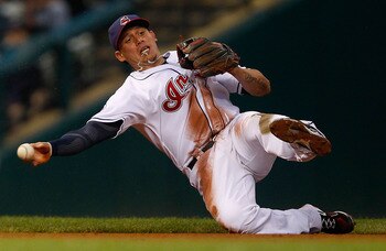 CLEVELAND - MAY 13:  Asdrubal Cabrera #13 of the Cleveland Indians fields a ground ball against the Seattle Mariners during the game on May 13, 2011 at Progressive Field in Cleveland, Ohio.  (Photo by Jared Wickerham/Getty Images)