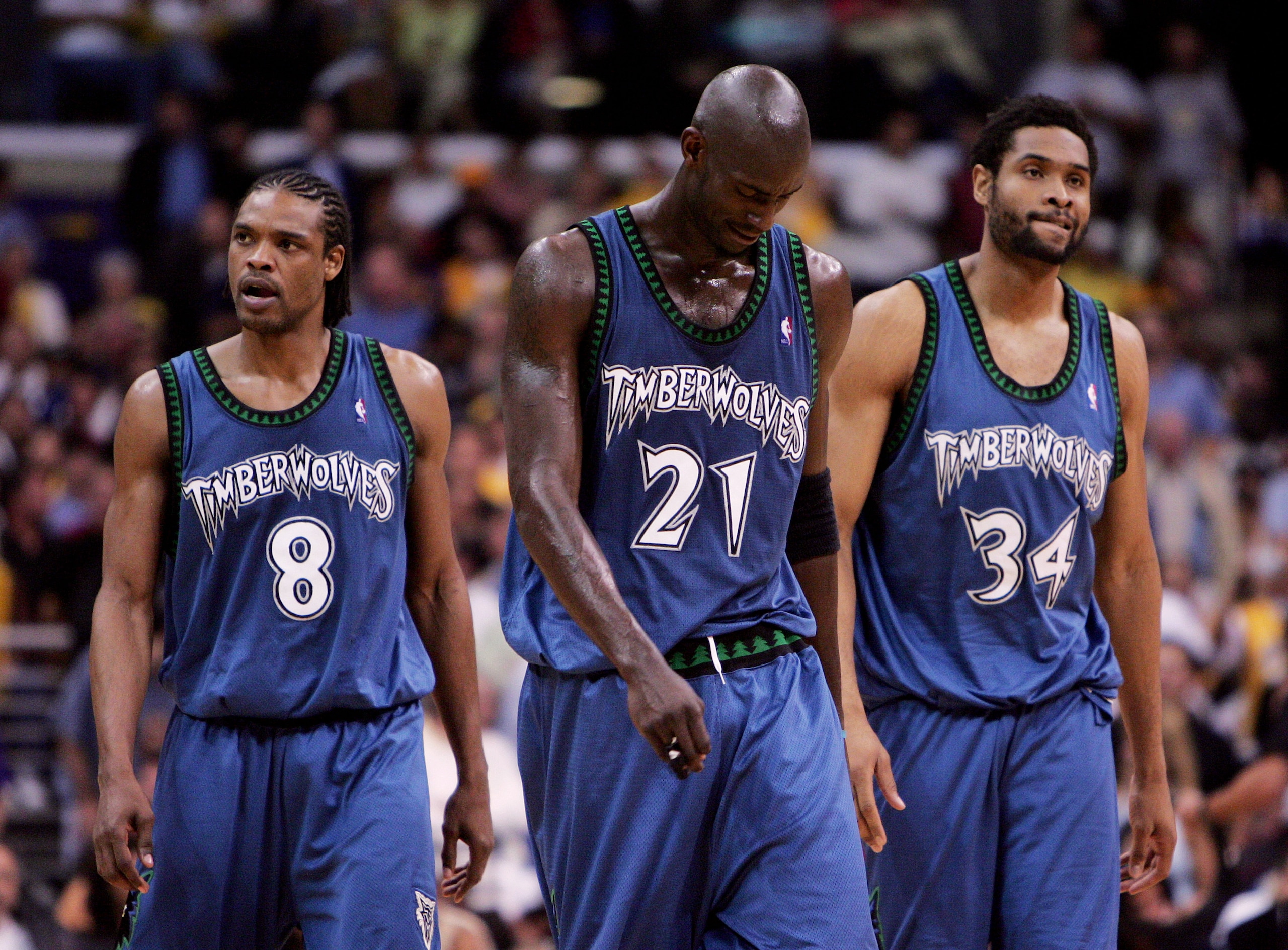 LOS ANGELES - MAY 25:  (L-R) Latrell Sprewell #8, Kevin Garnett #21 and Michael Olowokandi #34 of the Minnesota Timberwolves walk out onto the court after a time out against the Los Angeles Lakers in Game three of the Western Conference Finals during the