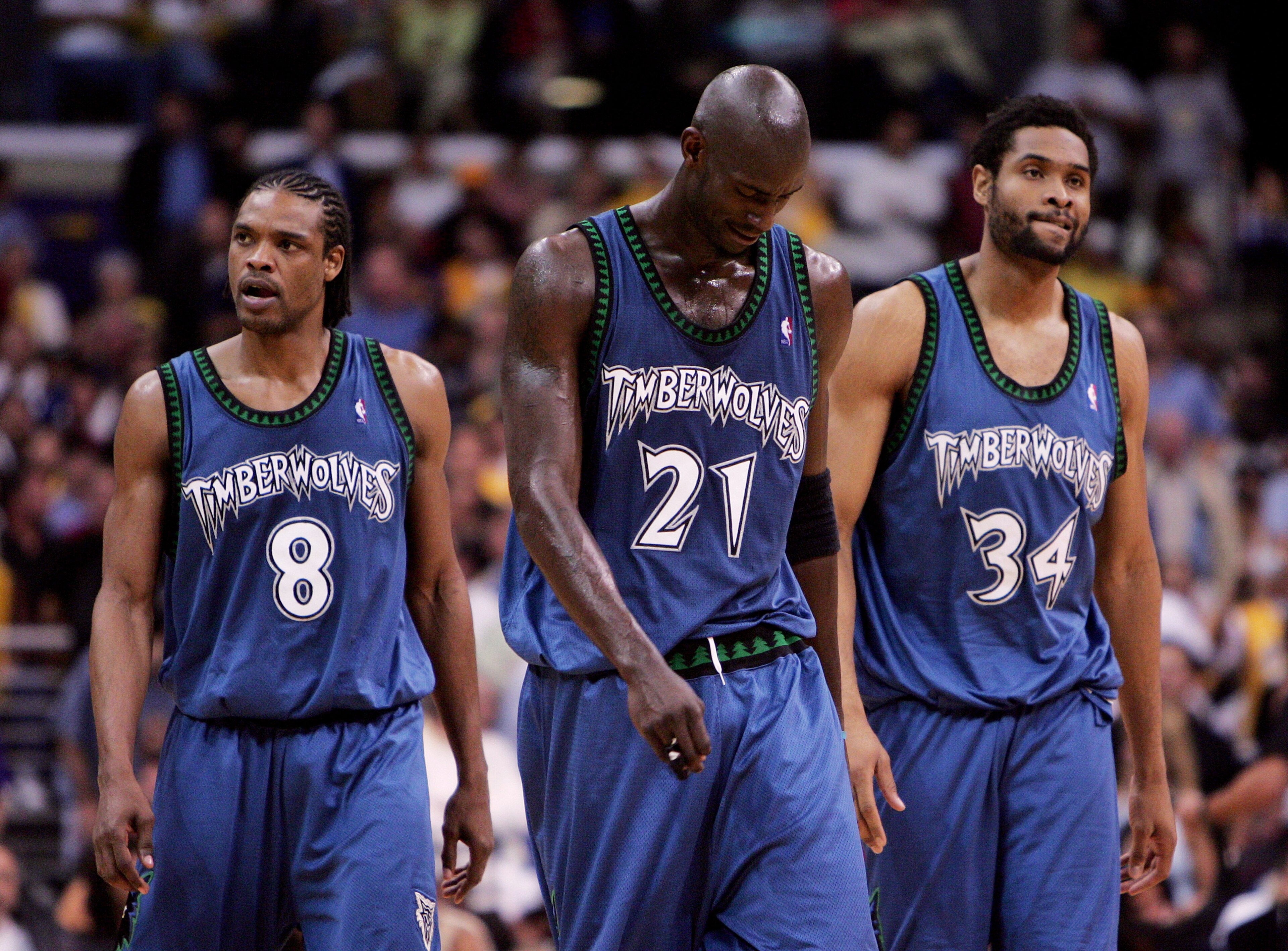 LOS ANGELES - MAY 25:  (L-R) Latrell Sprewell #8, Kevin Garnett #21 and Michael Olowokandi #34 of the Minnesota Timberwolves walk out onto the court after a time out against the Los Angeles Lakers in Game three of the Western Conference Finals during the