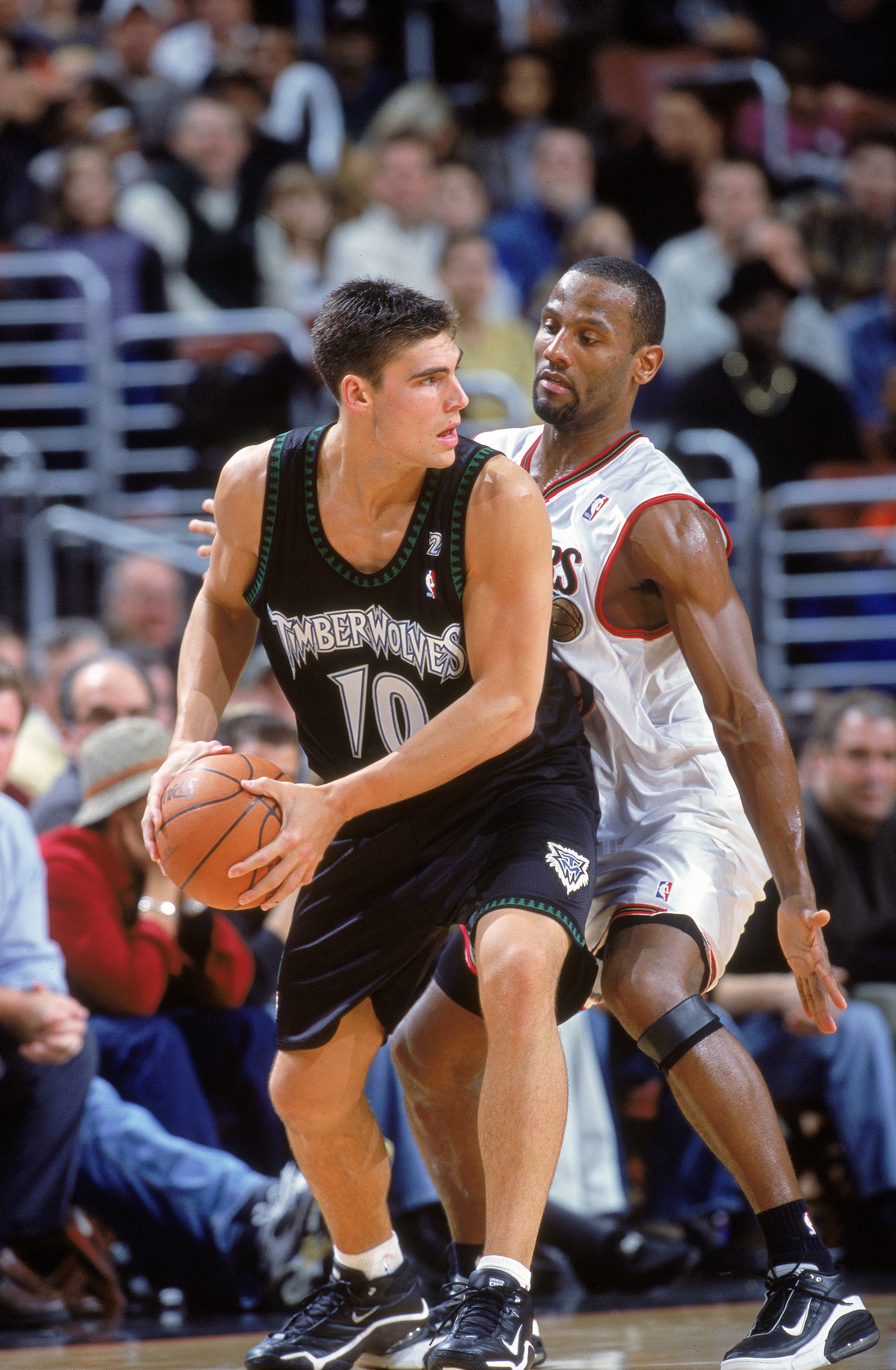 11 Dec 2000: Wally Szczerbiak #10 of the Minnesota Timberwolves looks to pass the ball as he is guarded by George Lynch #9 of the  Philadelphia 76ers at the First Union Center in Philadelphia, Pennsylvania. The Timberwolves defeated the 76ers 96-91. NOTE