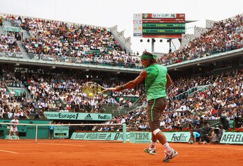 PARIS - JUNE 06:  Rafael Nadal of Spain hits a forehand during the Men's Singles Semi Final match against Novak Djokovic of Serbia on day thirteen of the French Open at Roland Garros on June 6, 2008 in Paris, France.  (Photo by Mike Hewitt/Getty Images)