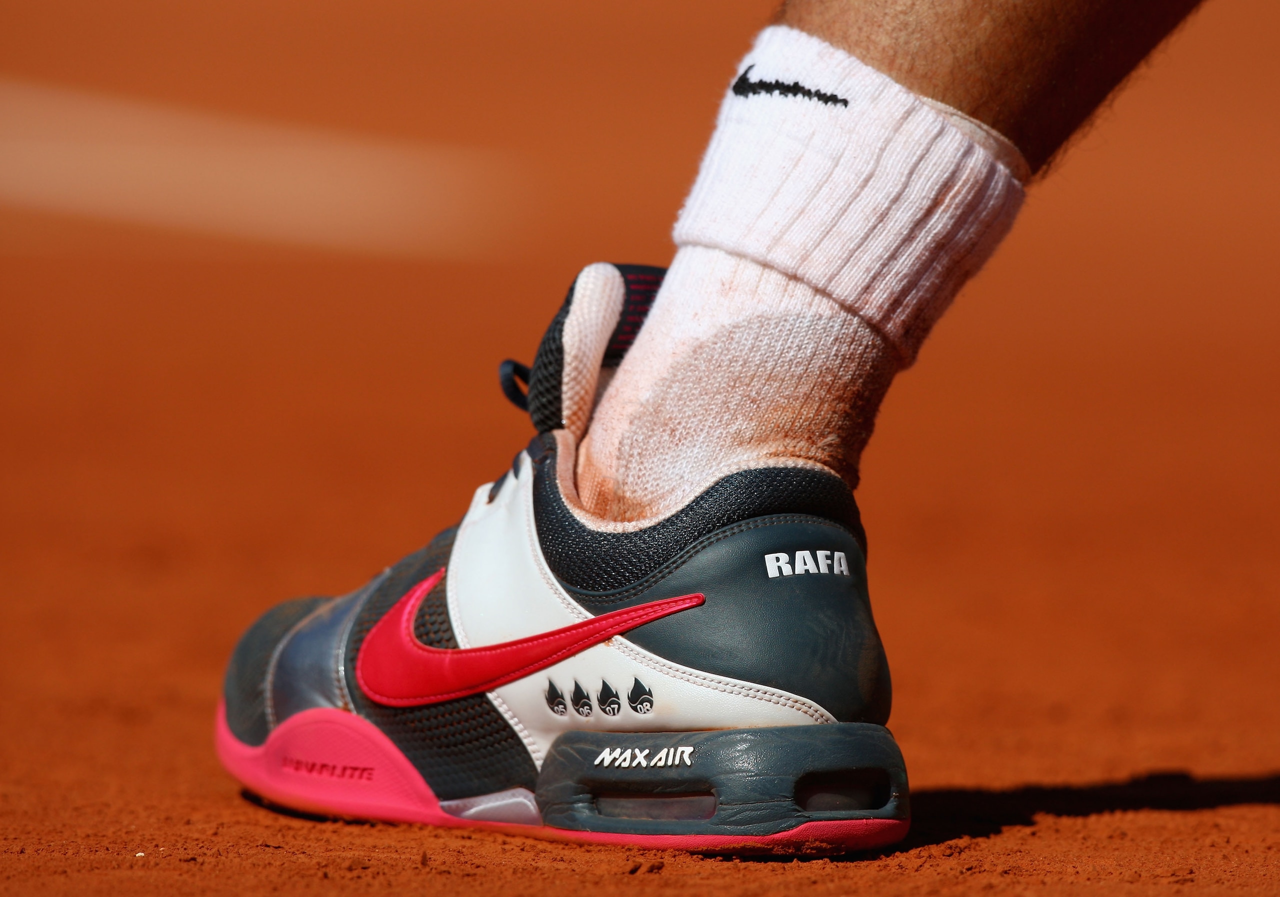 PARIS - MAY 29:  A general view of the footwear belonging to Rafael Nadal of Spain as he serves during his Men's Singles Third Round match against Lleyton Hewitt of Australia on day six of the French Open at Roland Garros on May 29, 2009 in Paris, France.
