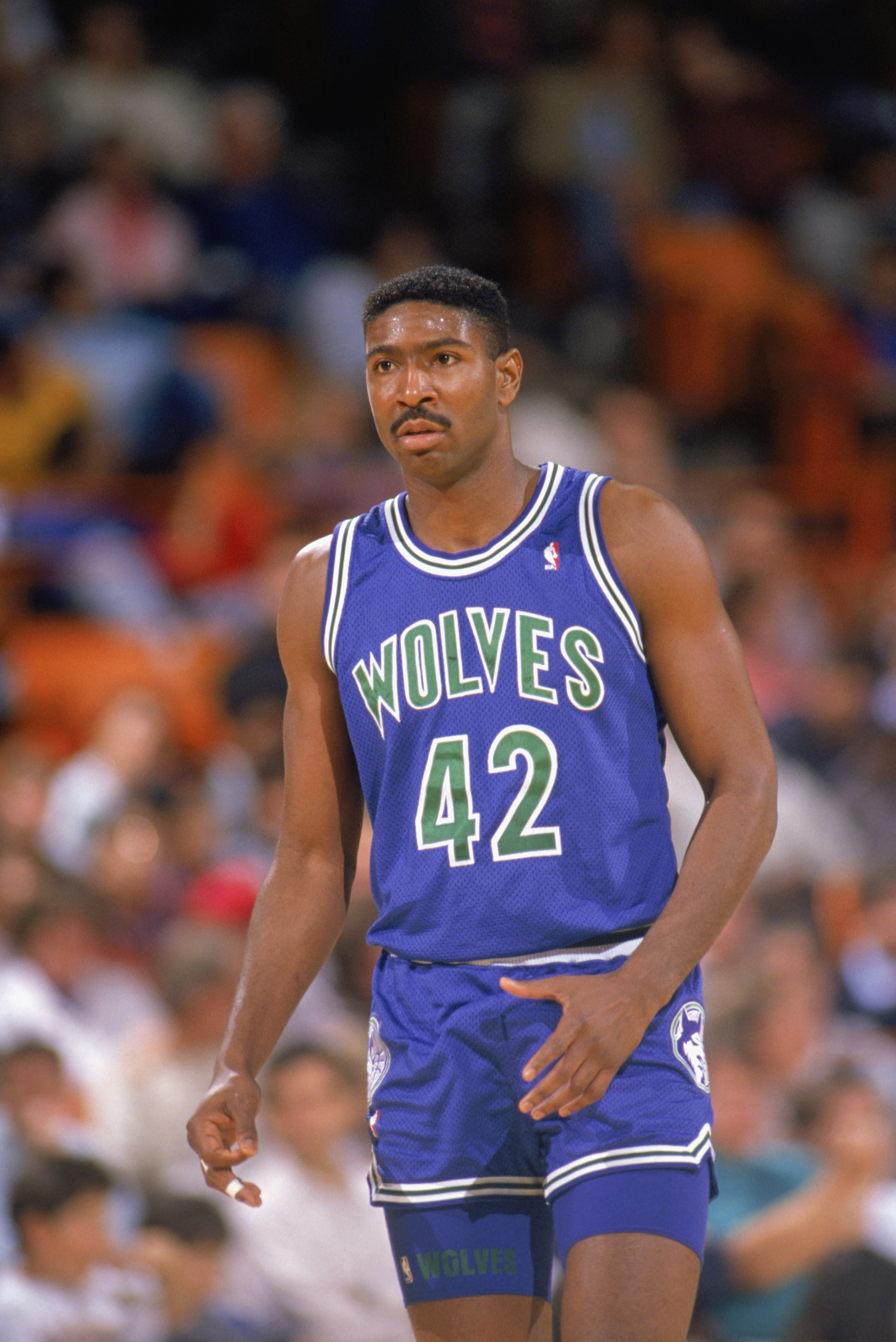 LOS ANGELES - 1990:  Sam Mitchell #42 of the Minnesota Timberwolves walks on the court during a game against the Los Angeles Lakers at the Great Western Forum in Los Angeles, California during the 1989-1990 NBA season.  (Photo by Ken Levine/Getty Images)