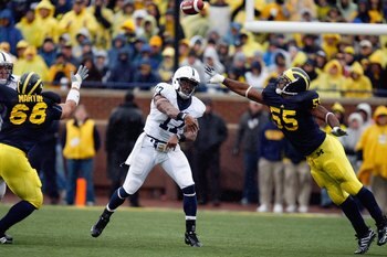 ANN ARBOR, MI - OCTOBER 24:  Daryll Clark #17 of the Penn State Nittany Lions passes against Mike Martin #68 and Brandon Graham #55 of the Michigan Wolverines on October 24, 2009 at Michigan Stadium in Ann Arbor, Michigan. (Photo by  Gregory Shamus/Getty