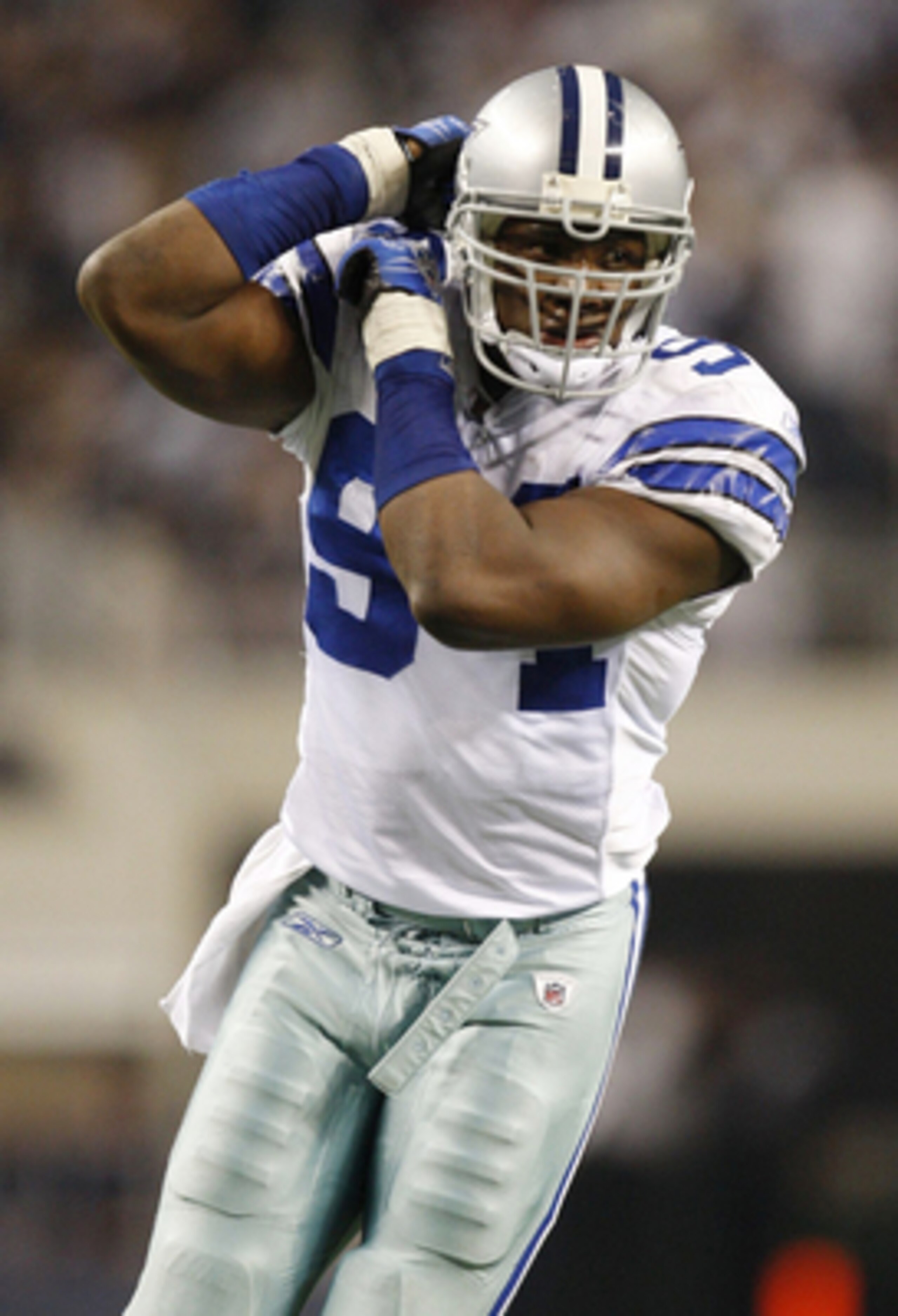 ARLINGTON, TX - JANUARY 9:  Linebacker DeMarcus Ware #94 of the Dallas Cowboys celebrates after forcing a fumble by the Philadelphia Eagles during the 2010 NFC wild-card playoff game at Cowboys Stadium on January 9, 2010 in Arlington, Texas. (Photo by Ron