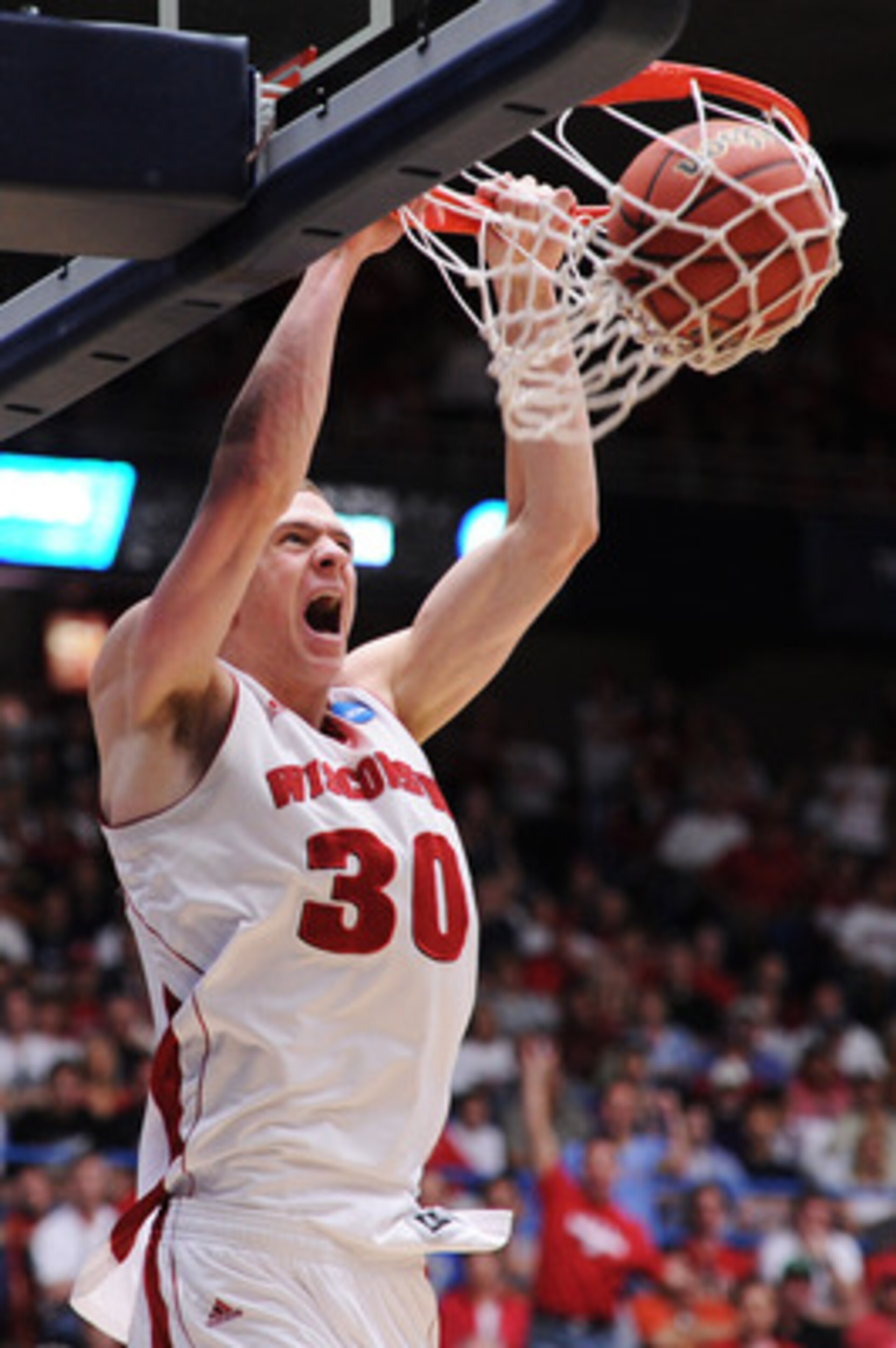 TUCSON, AZ - MARCH 19: Jon Leuer #30 of the Wisconsin Badgers dunks against the Kansas State Wildcats in the first half during the third round of the 2011 NCAA men's basketball tournament at McKale Center on March 19, 2011 in Tucson, Arizona. (Photo by TUCSON, AZ - MARCH 19: Jon Leuer #30 of the Wisconsin Badgers dunks against the Kansas State Wildcats in the first half during the third round of the 2011 NCAA men's basketball tournament at McKale Center on March 19, 2011 in Tucson, Arizona. (Photo by