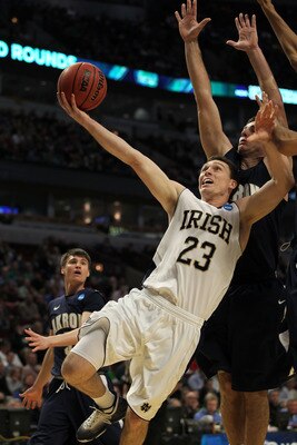 CHICAGO, IL - MARCH 18:  Ben Hansbrough #23 of the Notre Dame Fighting Irish shoots against Nikola Cvetinovic #13 of the Akron Zips in the first half during the second round of the 2011 NCAA men's basketball tournament at the United Center on March 18, 20