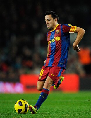BARCELONA, SPAIN - JANUARY 02:  Xavi Hernandez of Barcelona passes the ball during the La Liga match between Barcelona and Levante UD at Camp Nou on January 2, 2011 in Barcelona, Spain. Barcelona won 2-1. Xavi Hernandez is set to make Barcelona history af
