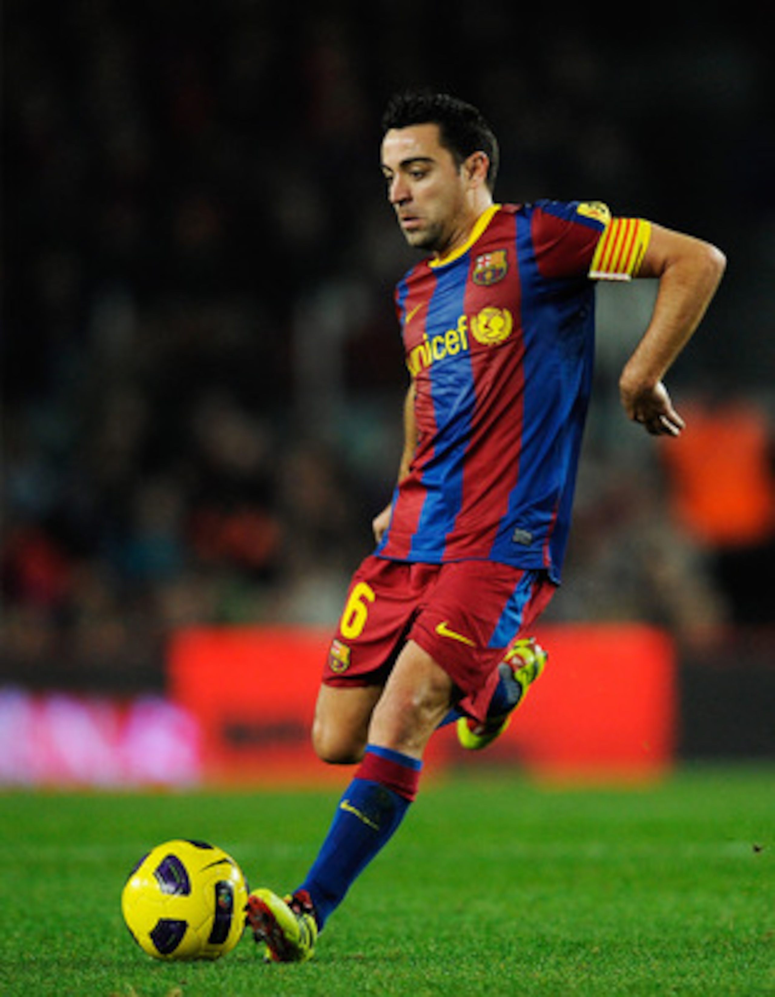 BARCELONA, SPAIN - JANUARY 02:  Xavi Hernandez of Barcelona passes the ball during the La Liga match between Barcelona and Levante UD at Camp Nou on January 2, 2011 in Barcelona, Spain. Barcelona won 2-1. Xavi Hernandez is set to make Barcelona history af