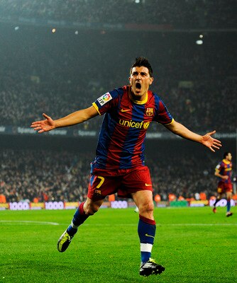 BARCELONA, SPAIN - JANUARY 16:  David Villa of FC Barcelona celebrates after scoring his side's second goal during the La Liga match between FC Barcelona and Malaga at Nou Camp on January 16, 2011 in Barcelona, Spain.  (Photo by David Ramos/Getty Images)