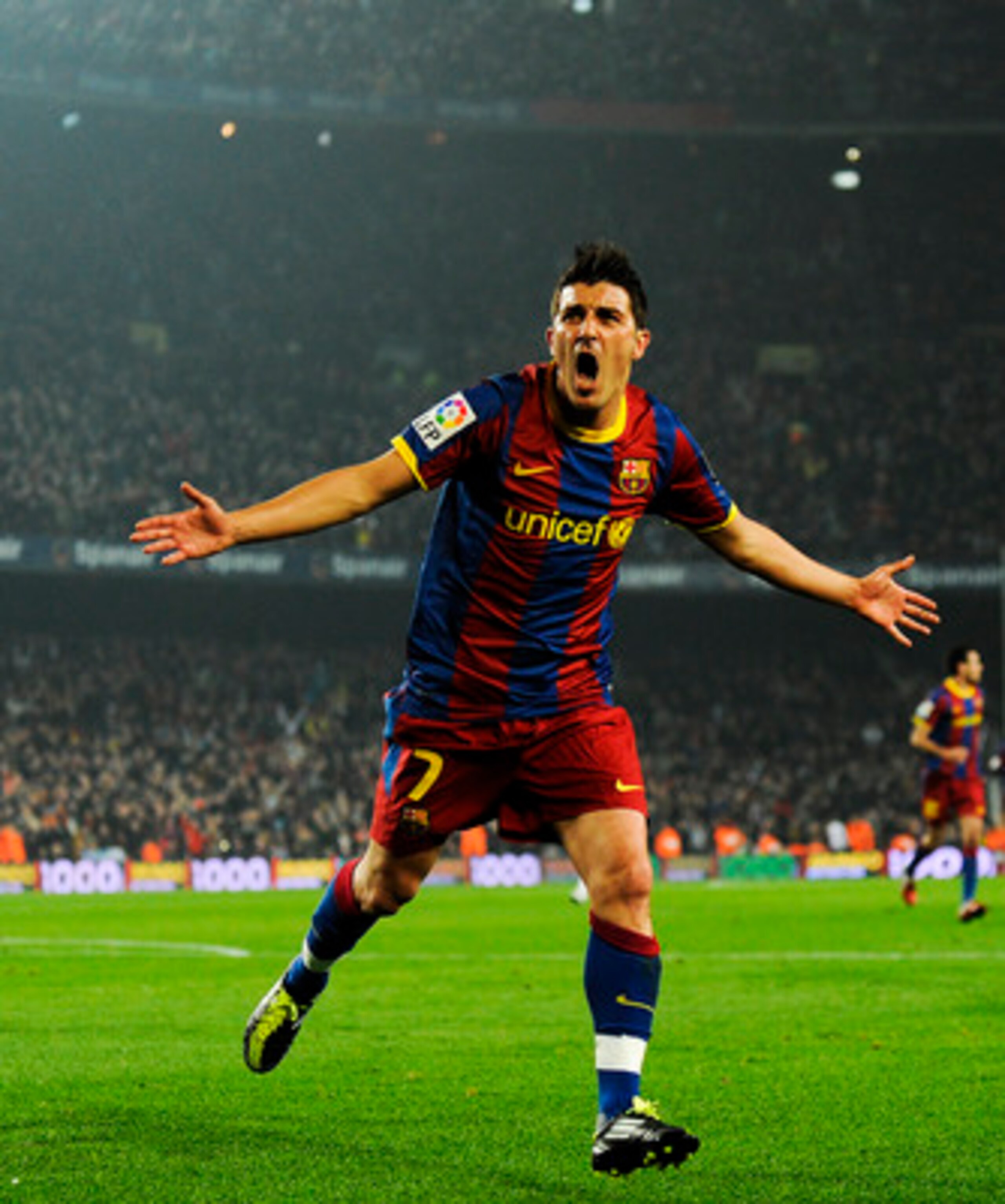 BARCELONA, SPAIN - JANUARY 16:  David Villa of FC Barcelona celebrates after scoring his side's second goal during the La Liga match between FC Barcelona and Malaga at Nou Camp on January 16, 2011 in Barcelona, Spain.  (Photo by David Ramos/Getty Images)