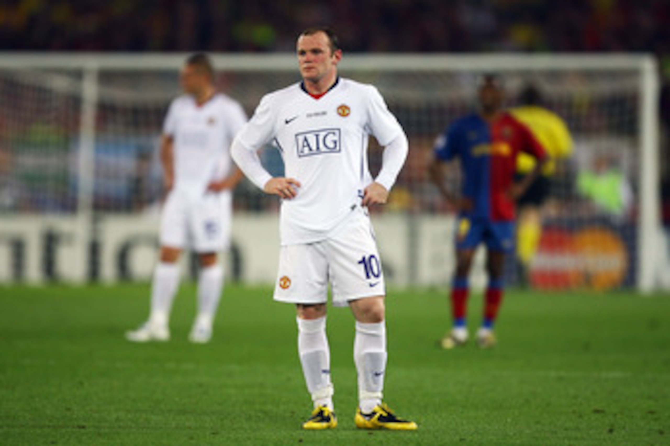 ROME - MAY 27:  Wayne Rooney of Manchester United looks dejected after Lionel Messi of Barcelona scored the second goal for Barcelona during the UEFA Champions League Final match between Barcelona and Manchester United at the Stadio Olimpico on May 27, 20
